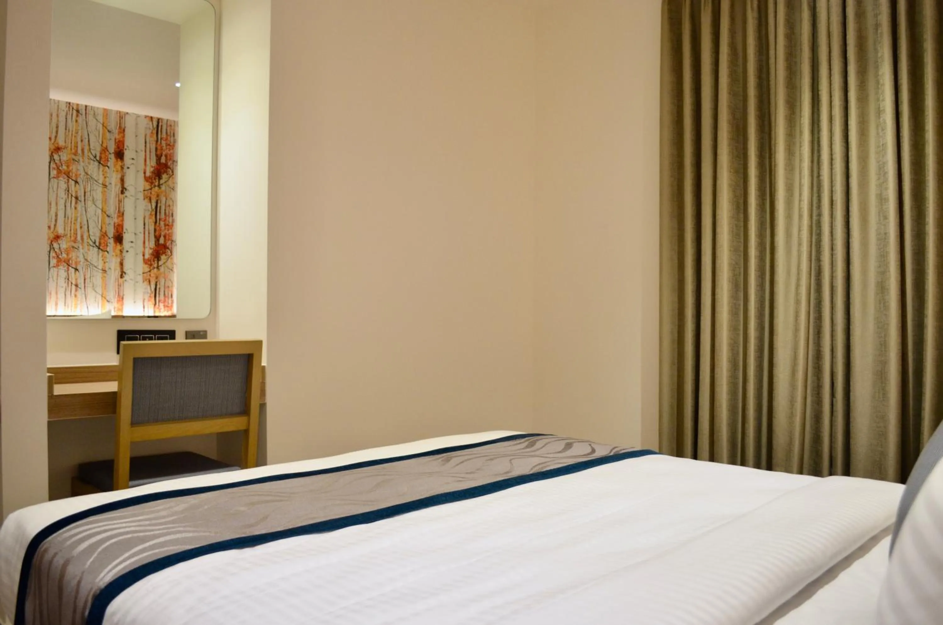 Bed in CITY LAKE HOTEL