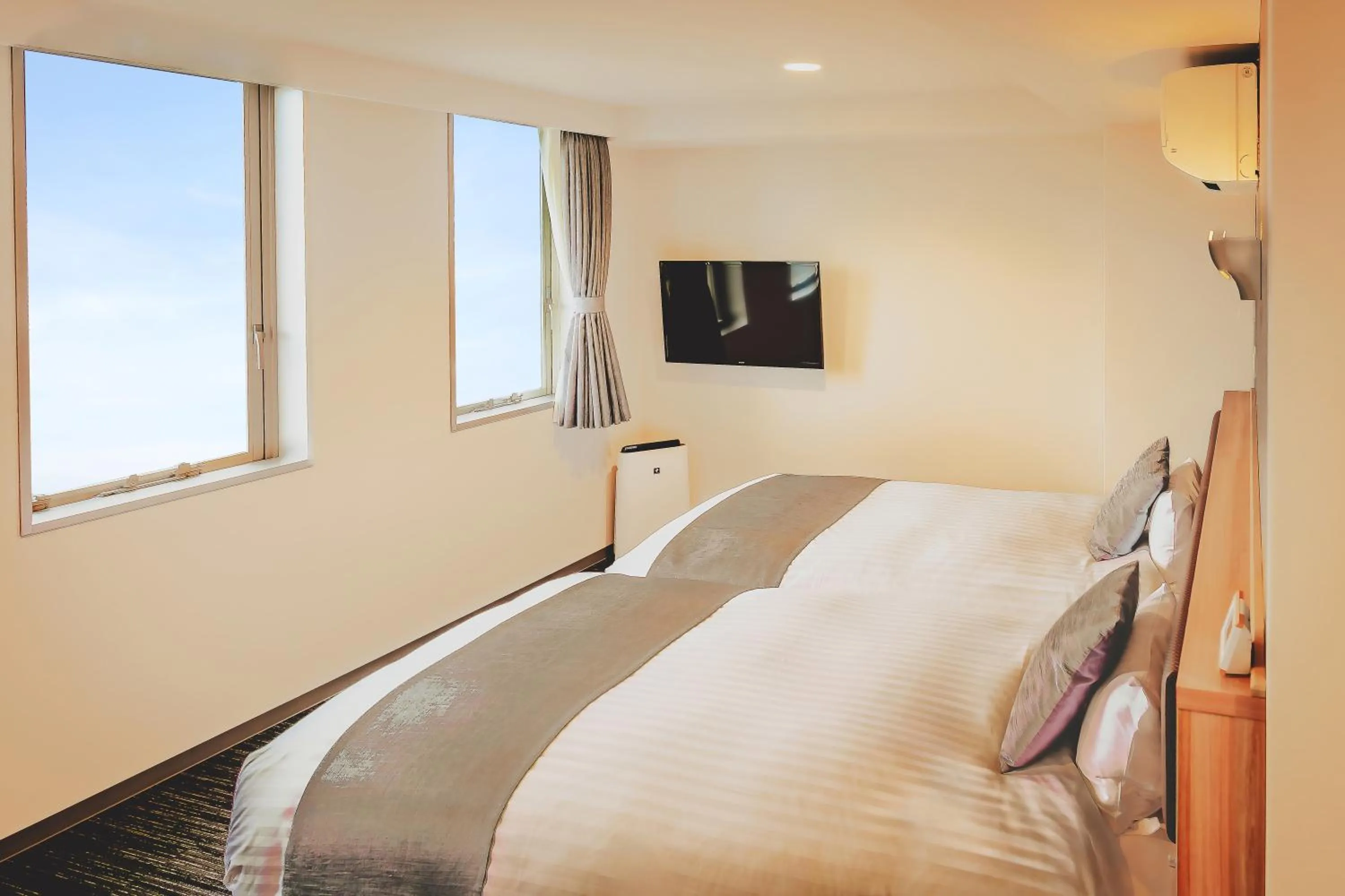 Bed in AIRAIKUHOTEL kagoshima