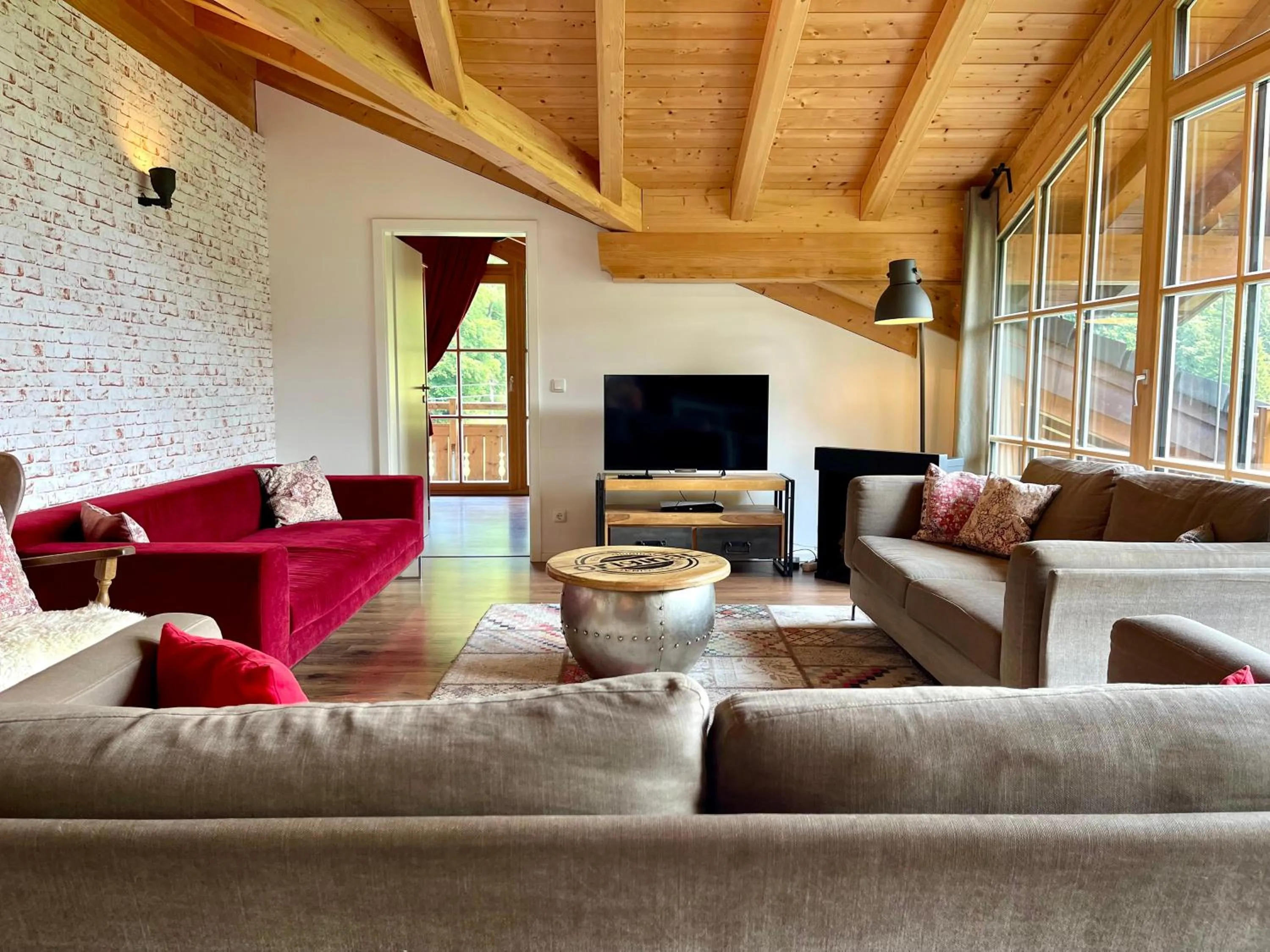 Living room in Alpenlodge Charivari - SommerBergBahn unlimited kostenlos