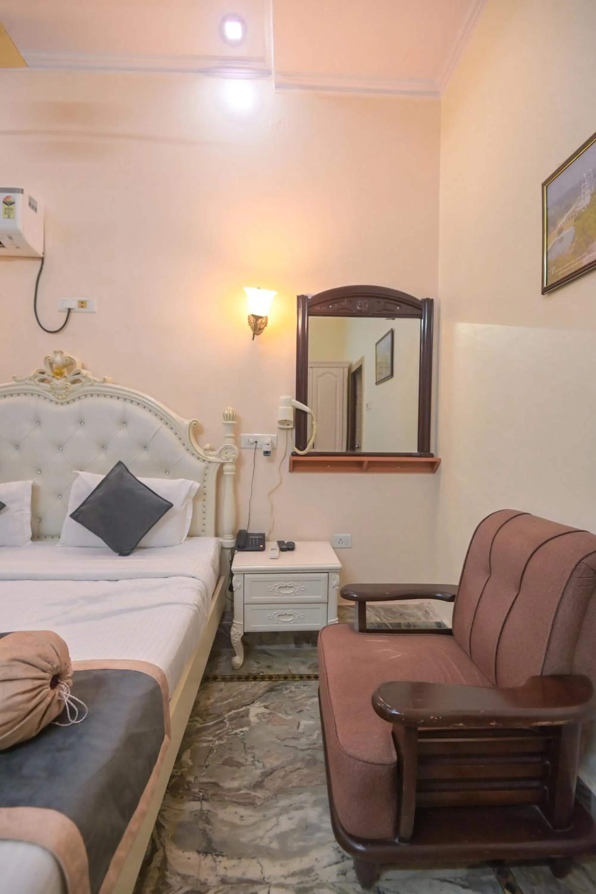 Seating area, Bed in Shree Ganesha Palace Near Kashi Vishwanath Temple