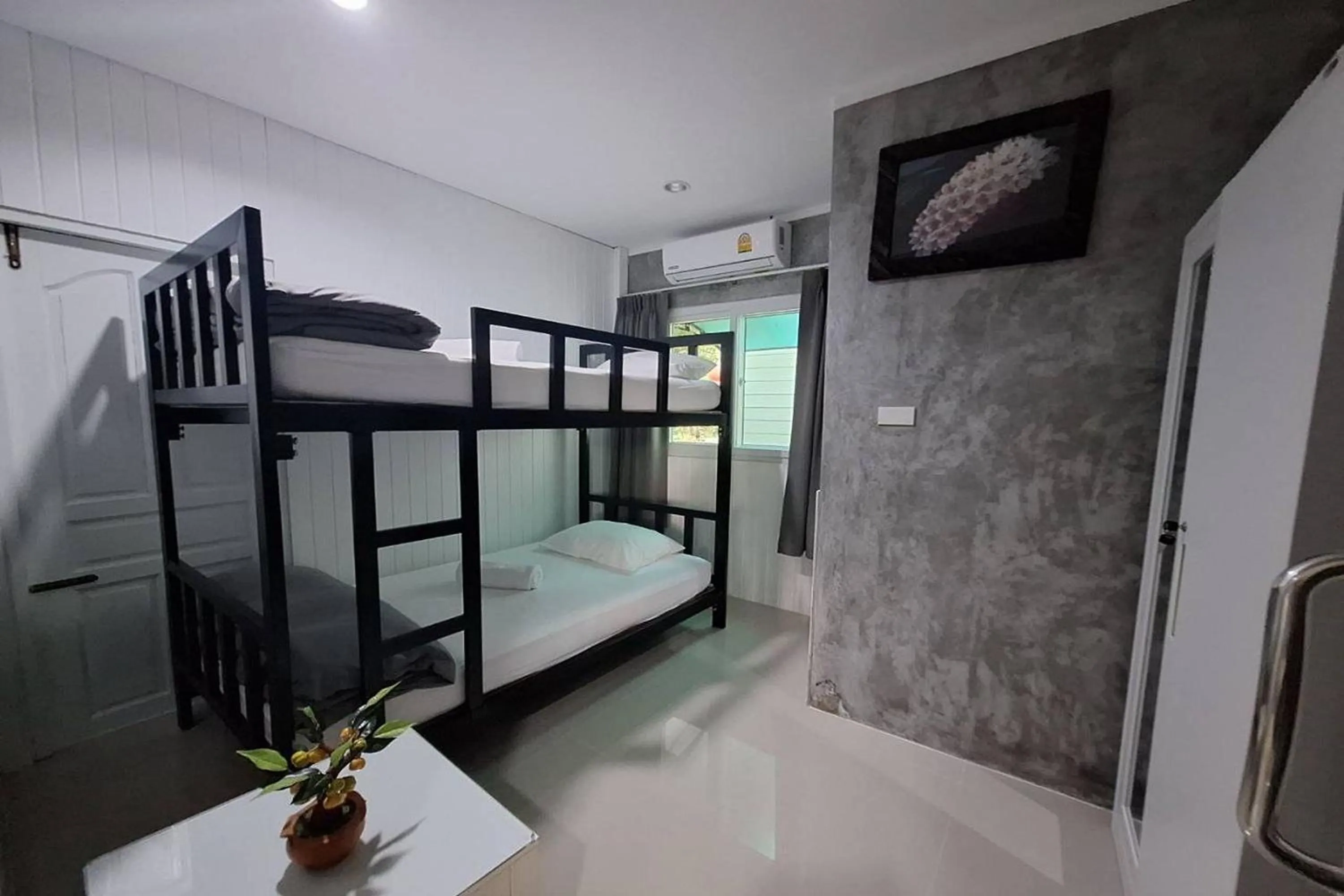 Bed in Maikhao Home Garden Bungalow