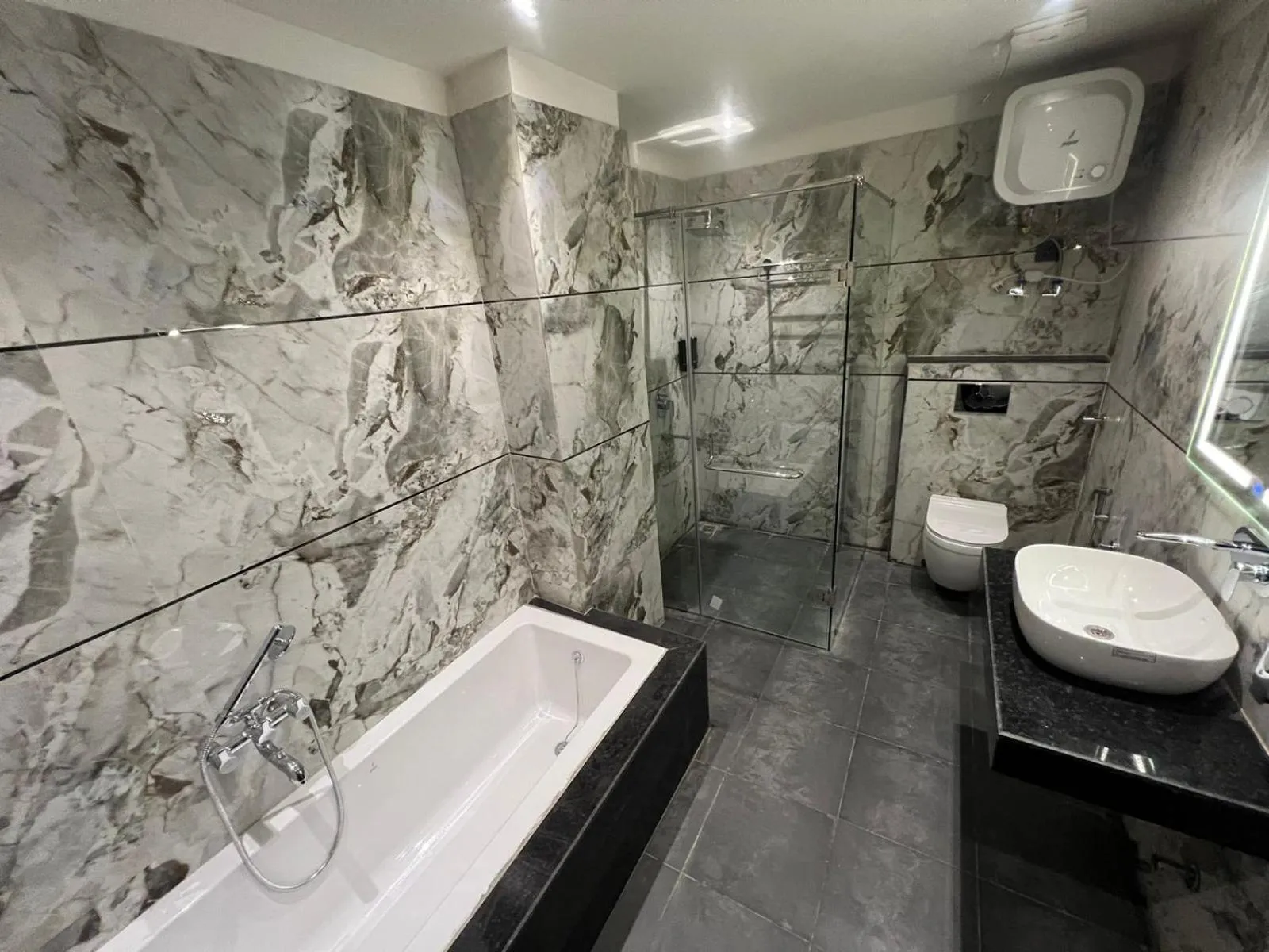 Shower in Hotel Majestic Grand By MNG Rooms