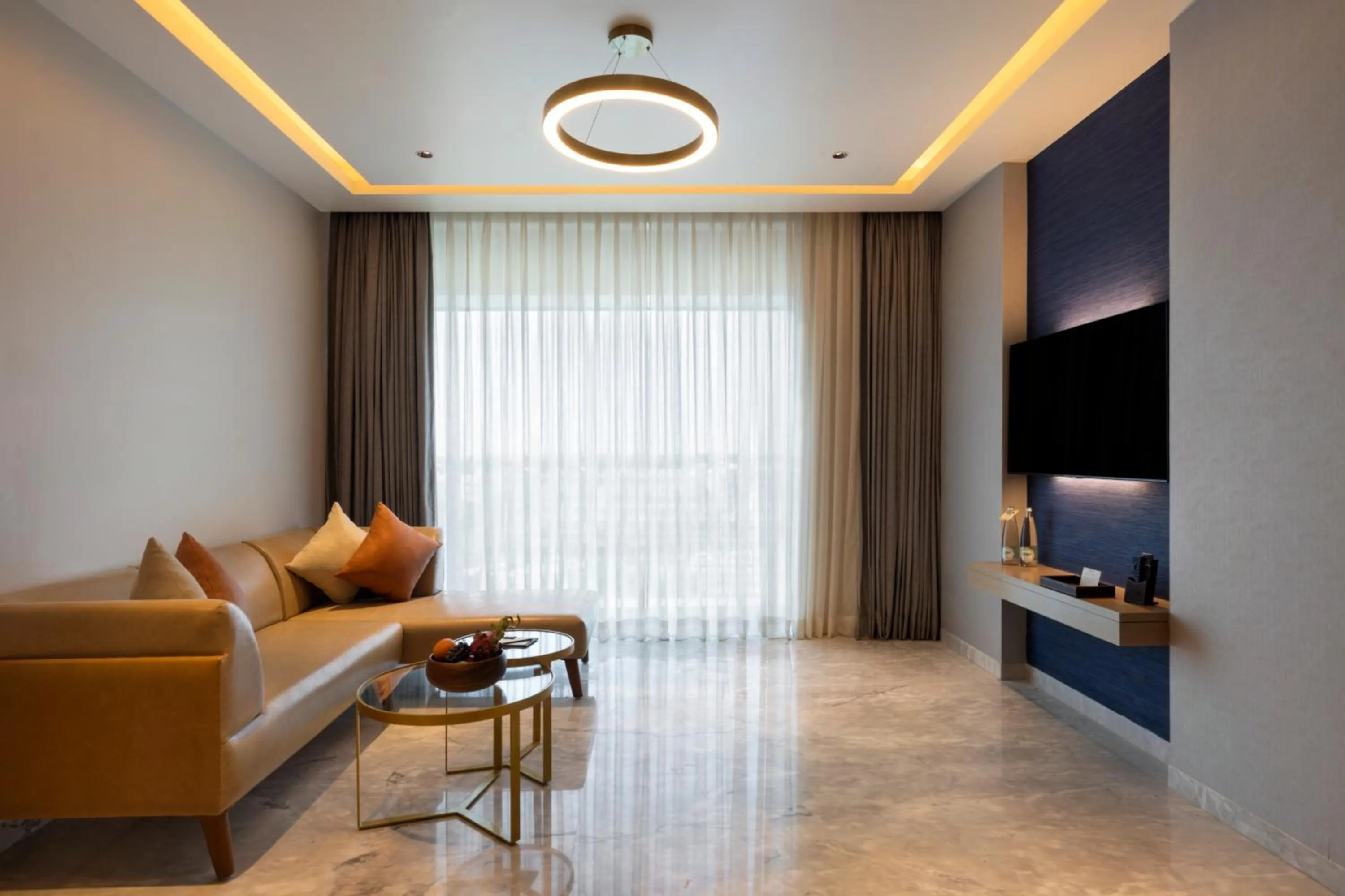 Living room in Grand Madurai by GRT Hotels