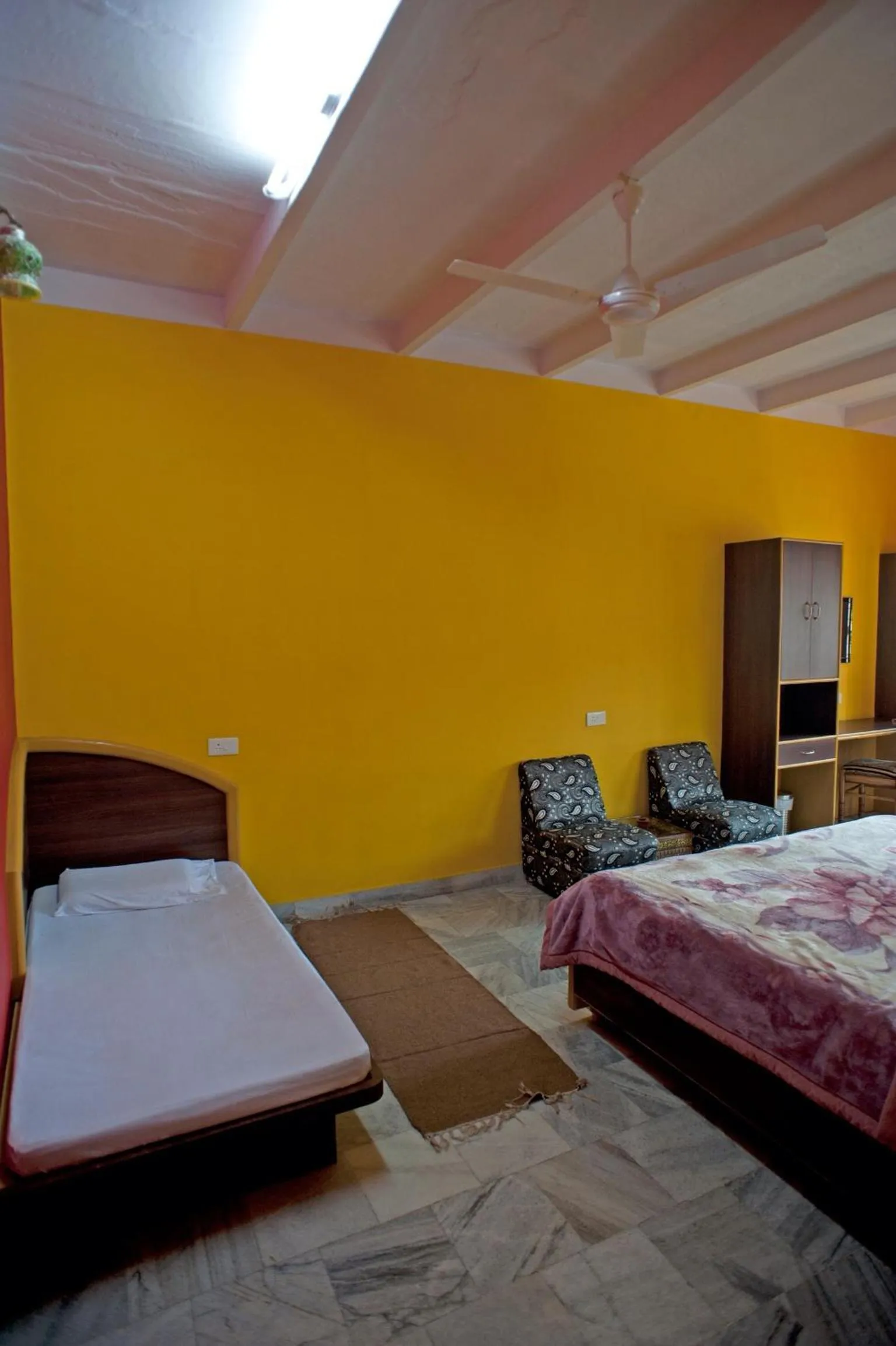 Bed in Ganpati Guest House