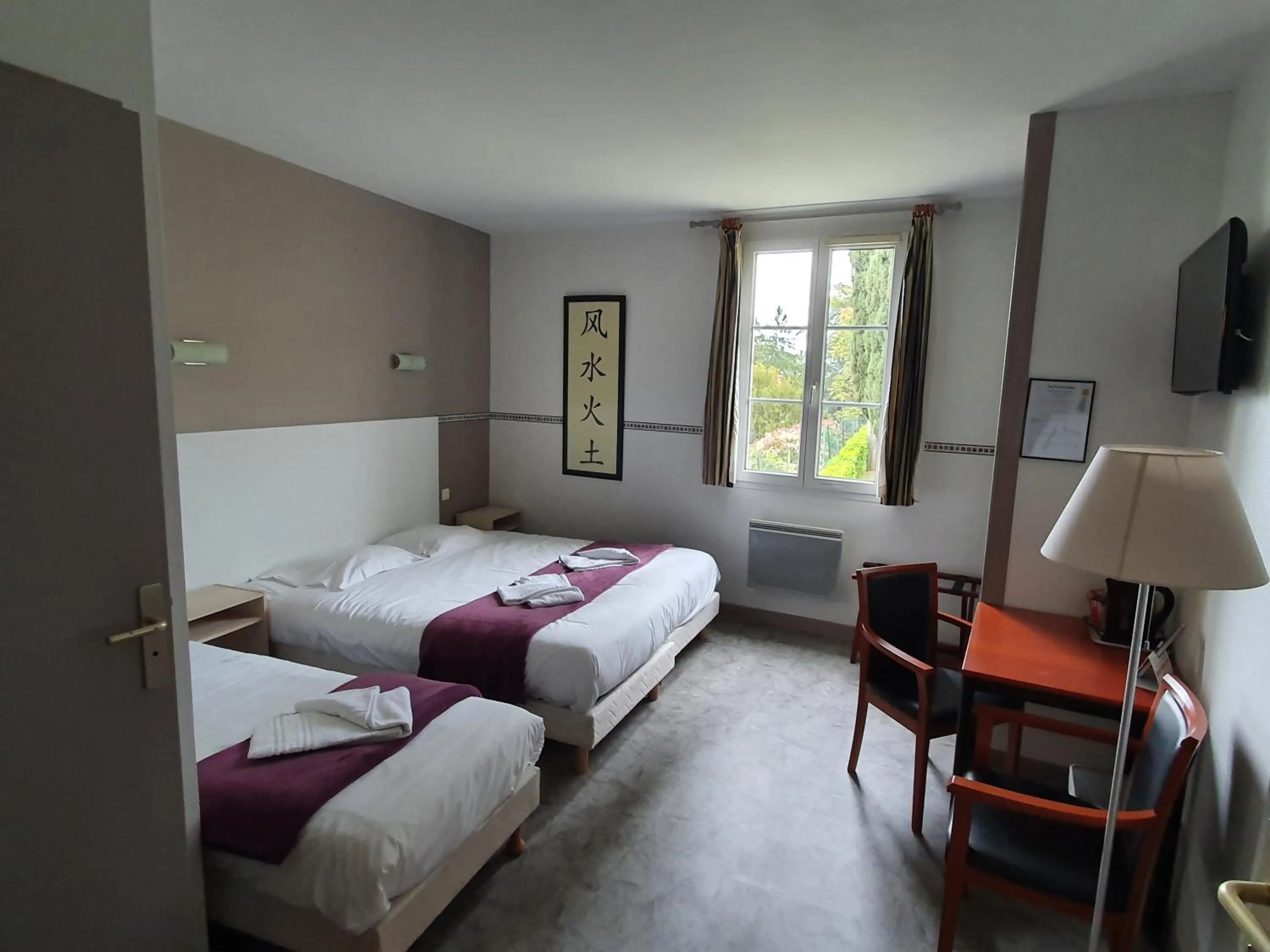 Triple Room with Garden View in Hôtel Restaurant La Promenade