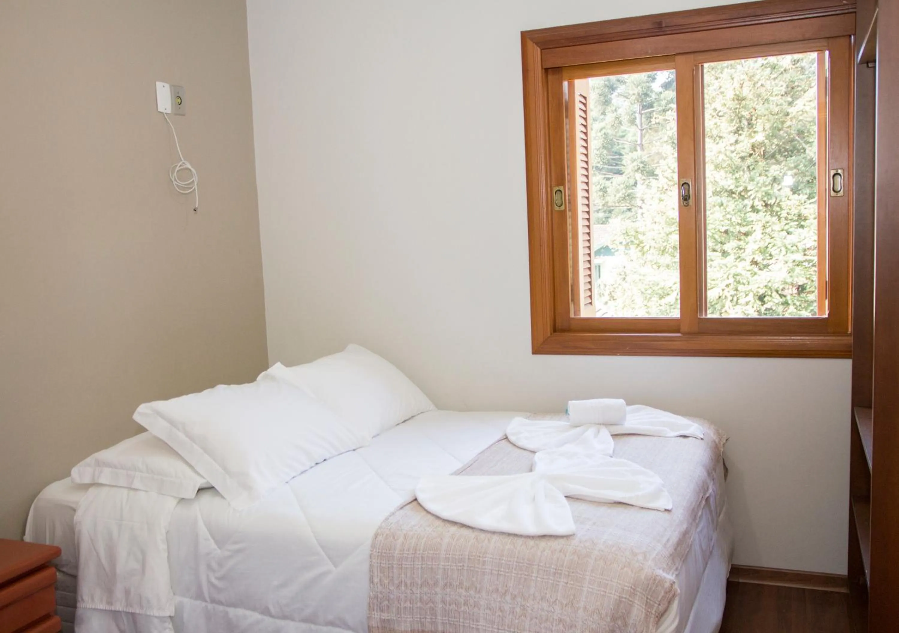 Bed in Pousada Caminho dos Plátanos