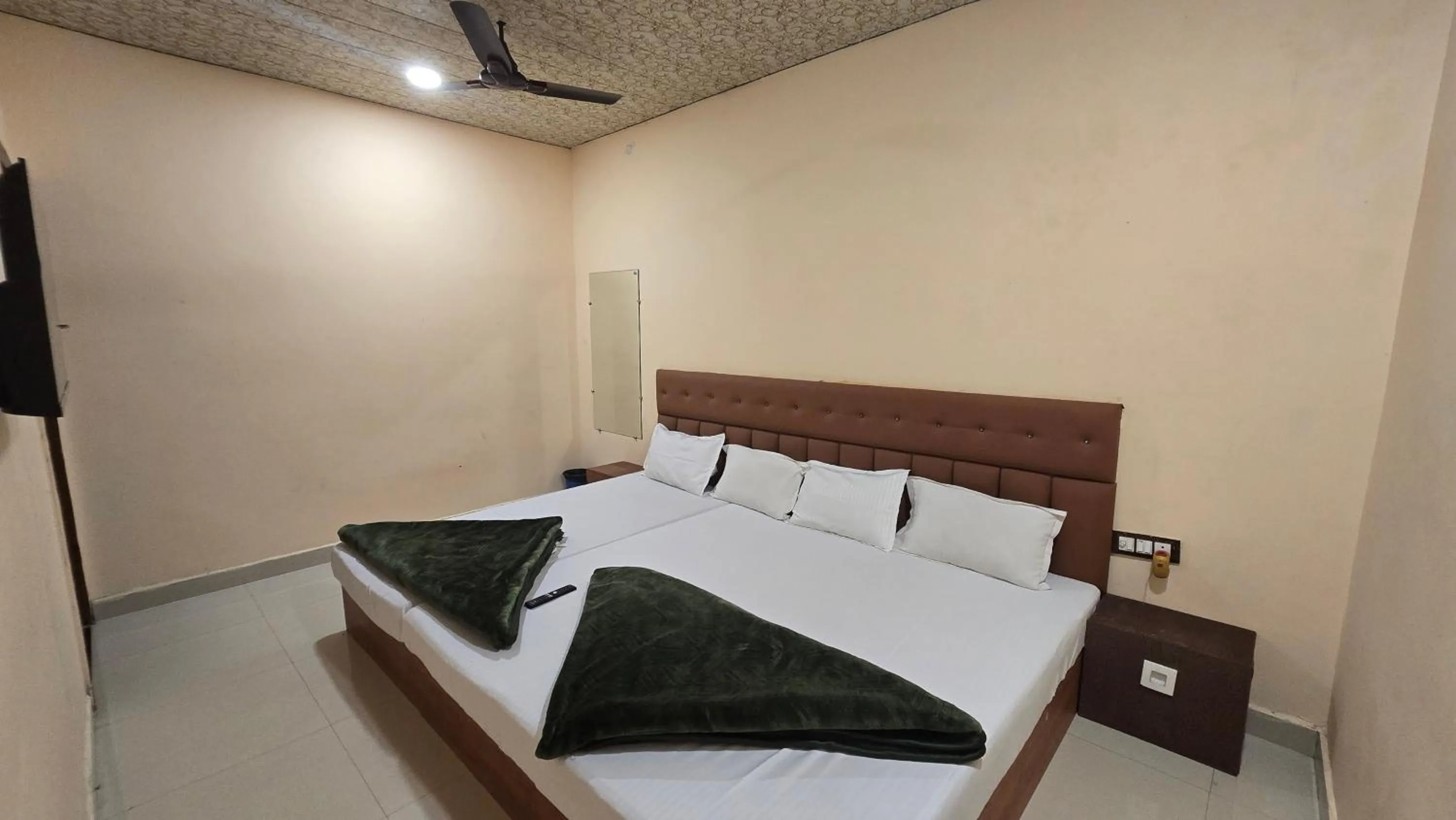Bed in HOTEL MAHESHWARI GREEN's