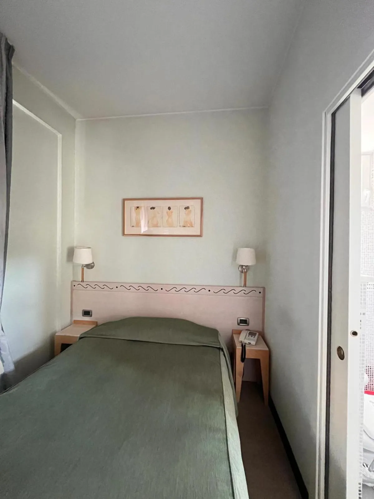 Bed in HOTEL LUDOVICO ARIOSTO