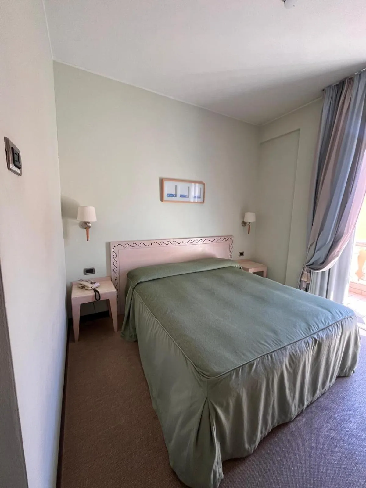 Bed in HOTEL LUDOVICO ARIOSTO