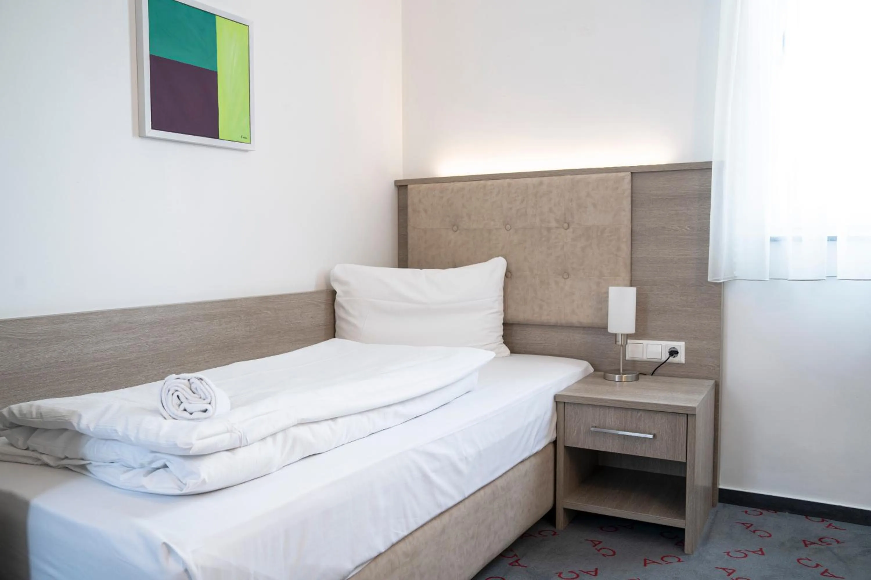 Bed in Alpha & Omega Hotel Stuttgart