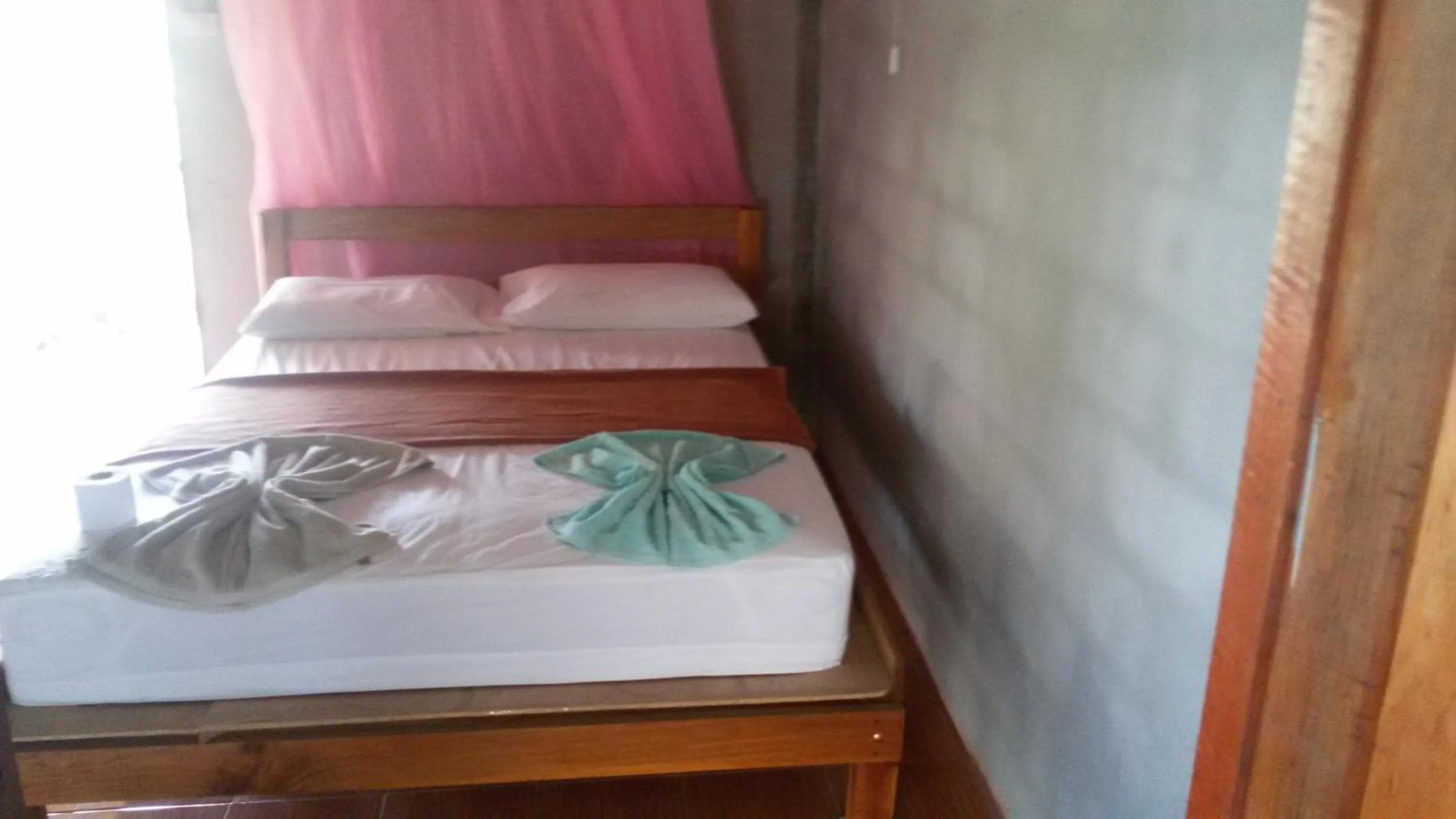 Bed in Green Chilli Bungalows