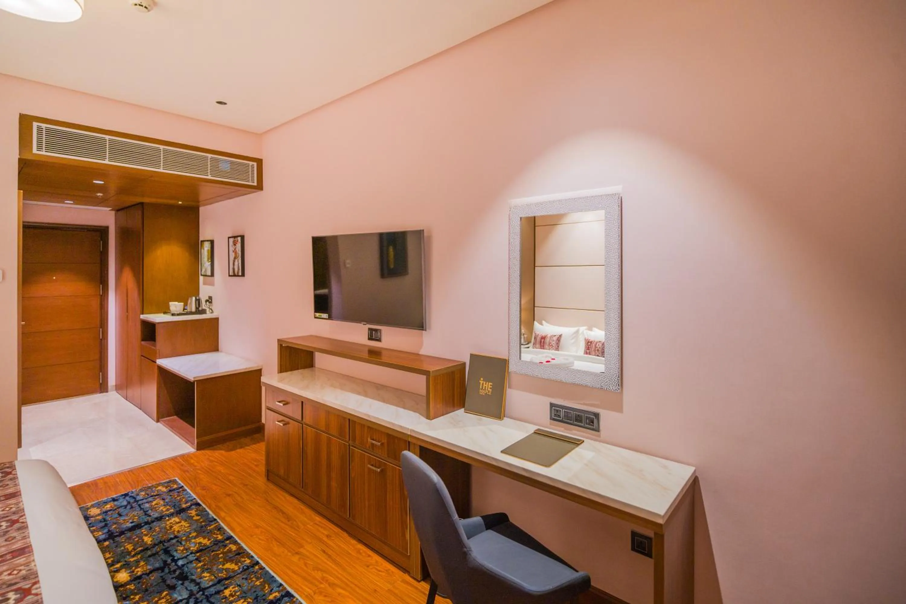 Communal lounge/ TV room in The Maple Hotel