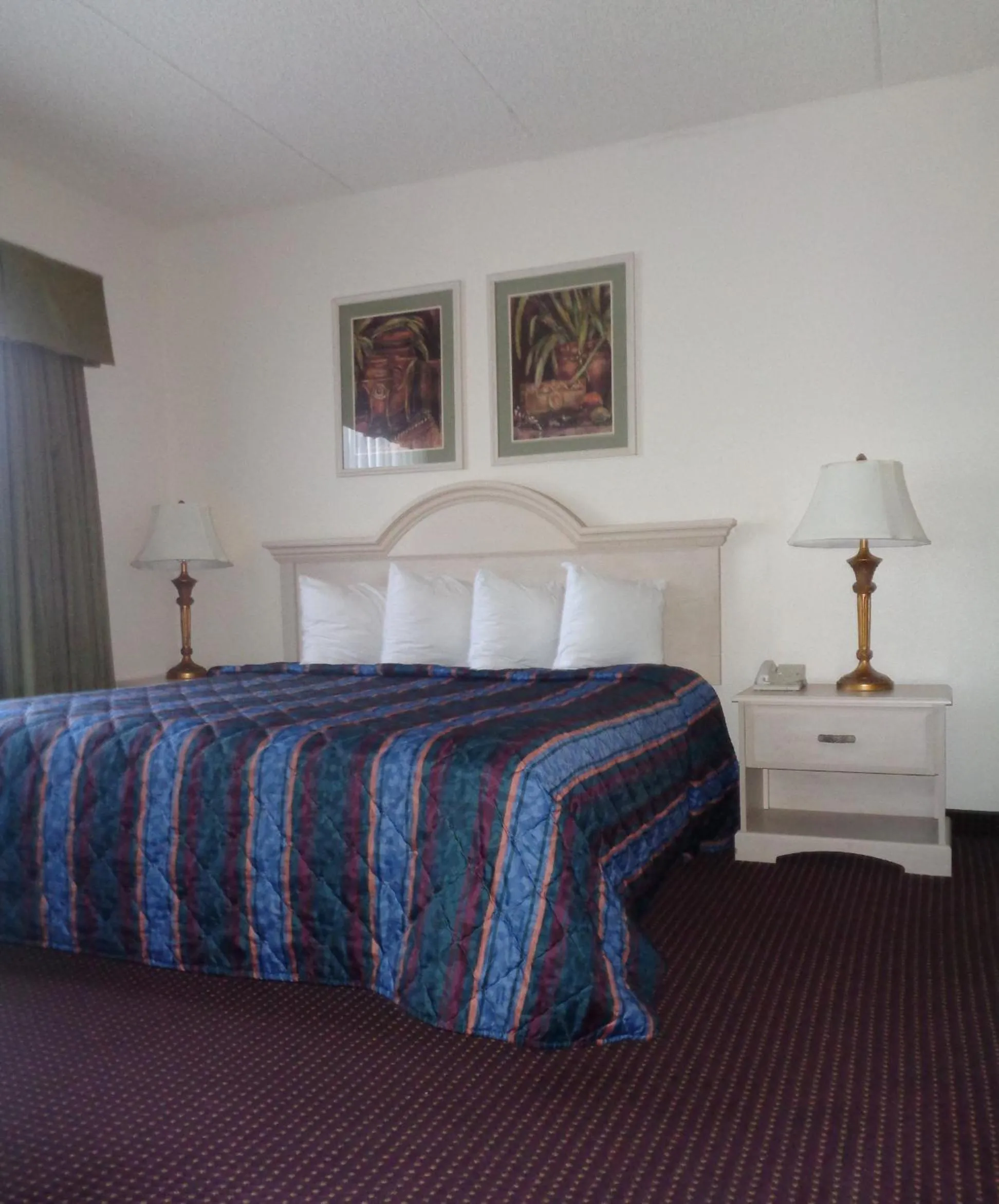 Bed in Allure Suites of Fort Myers