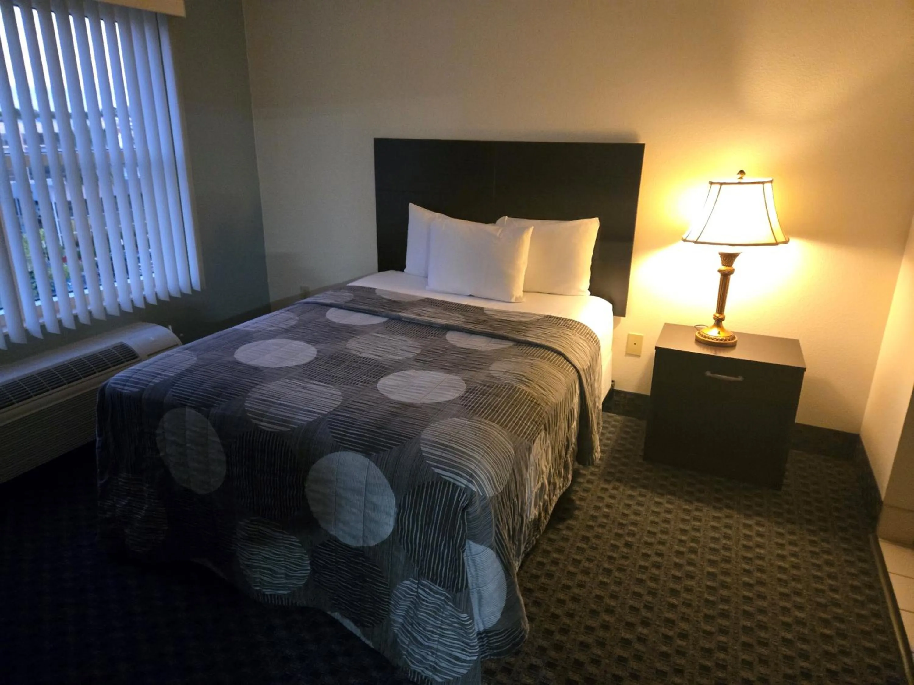 Bed in Allure Suites of Fort Myers