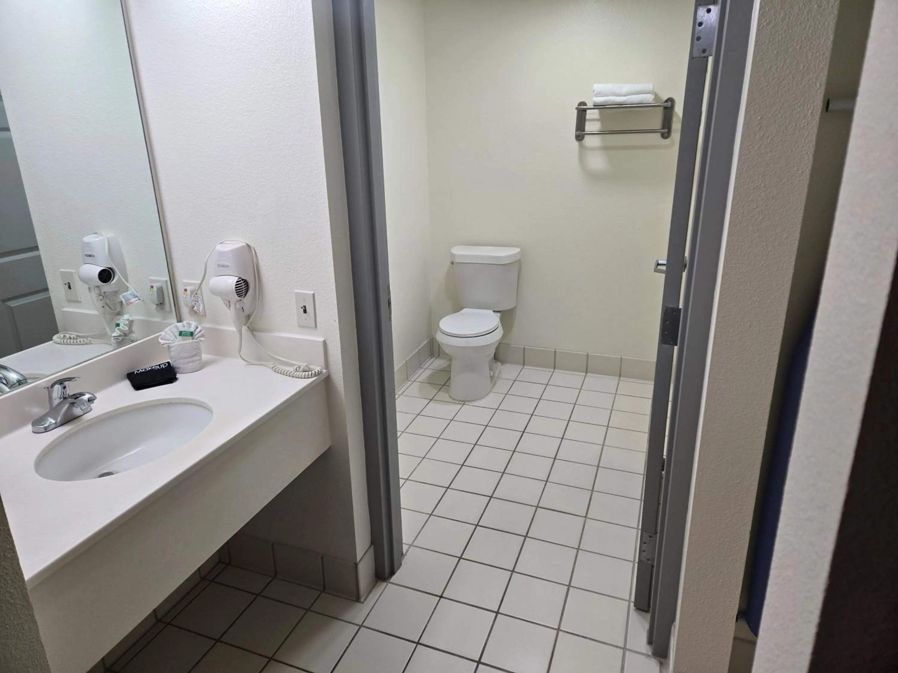 Toilet in Allure Suites of Fort Myers