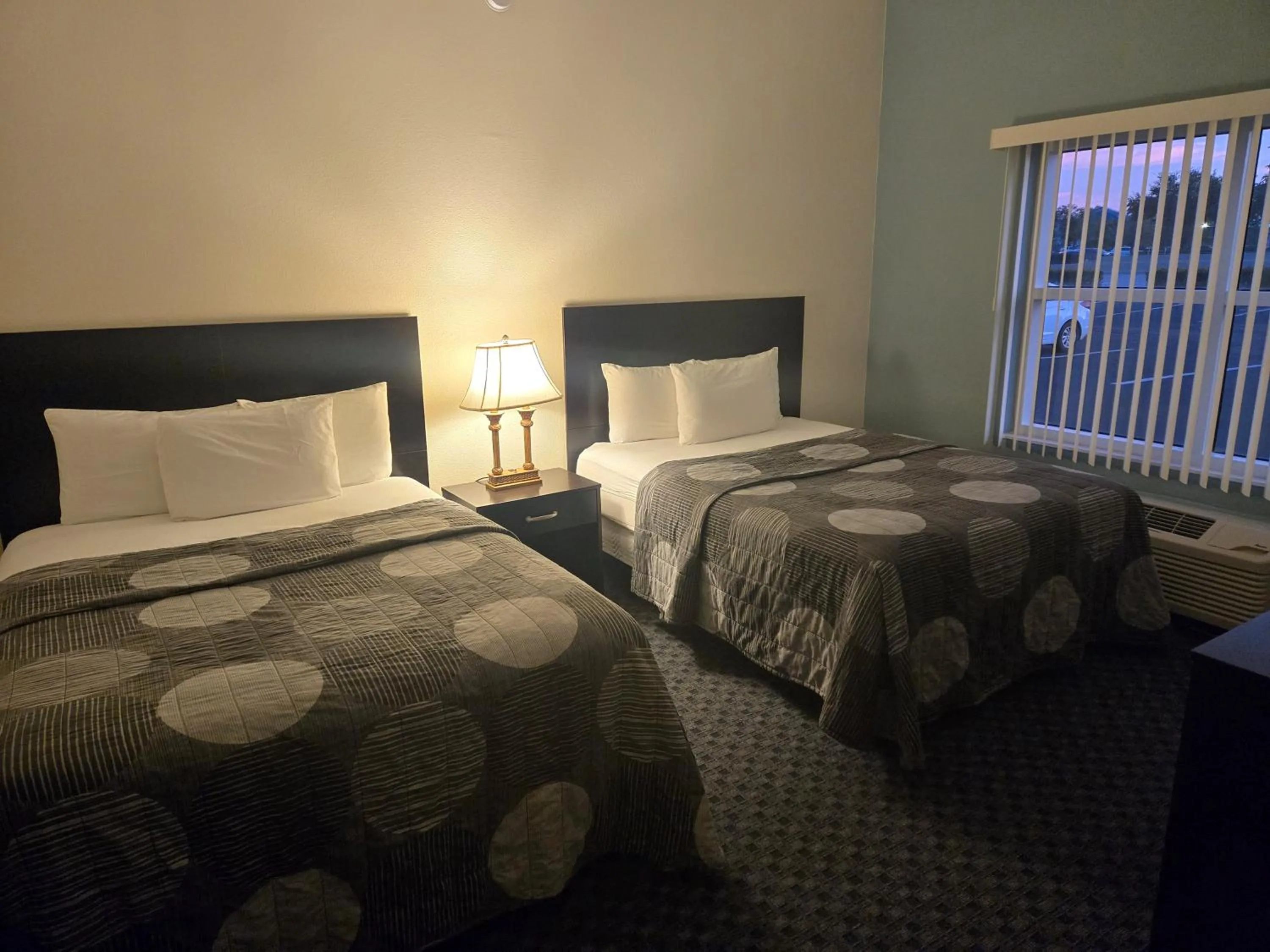 Bed in Allure Suites of Fort Myers