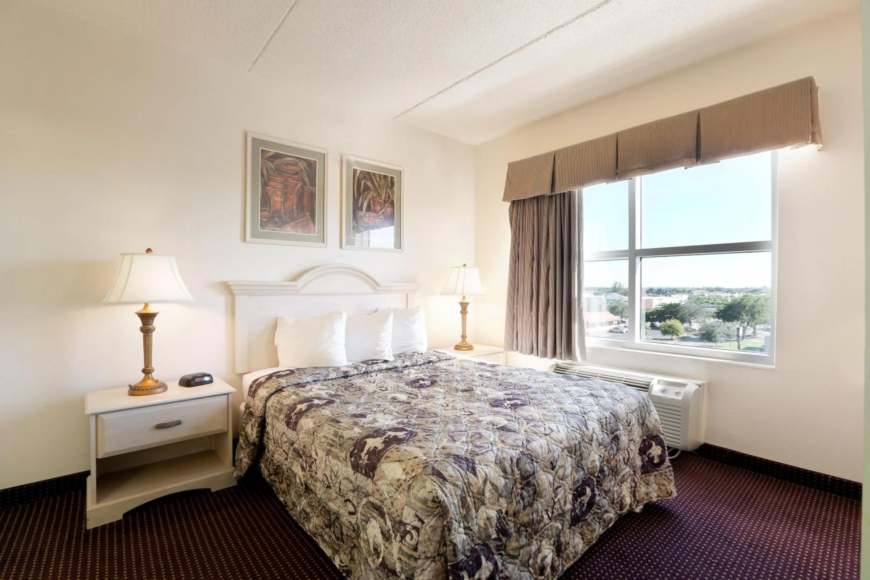 Bed in Allure Suites of Fort Myers