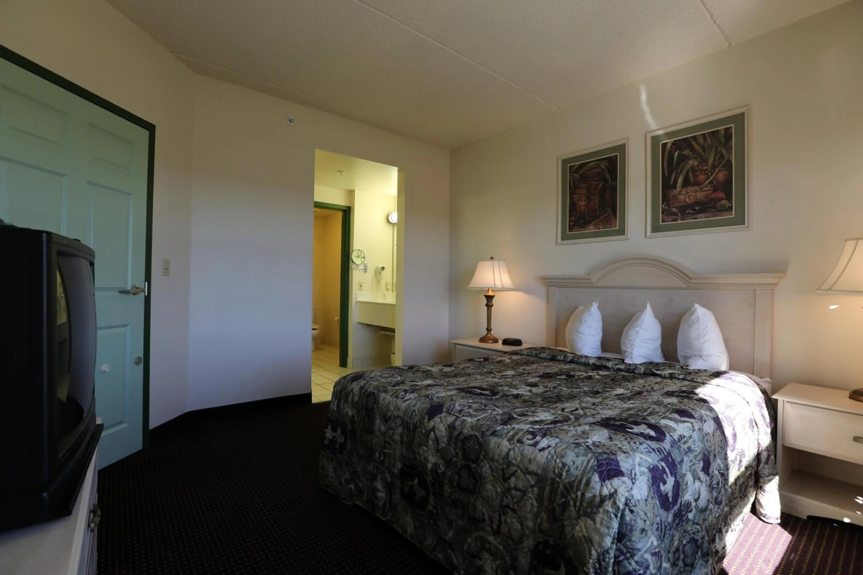 Bed in Allure Suites of Fort Myers