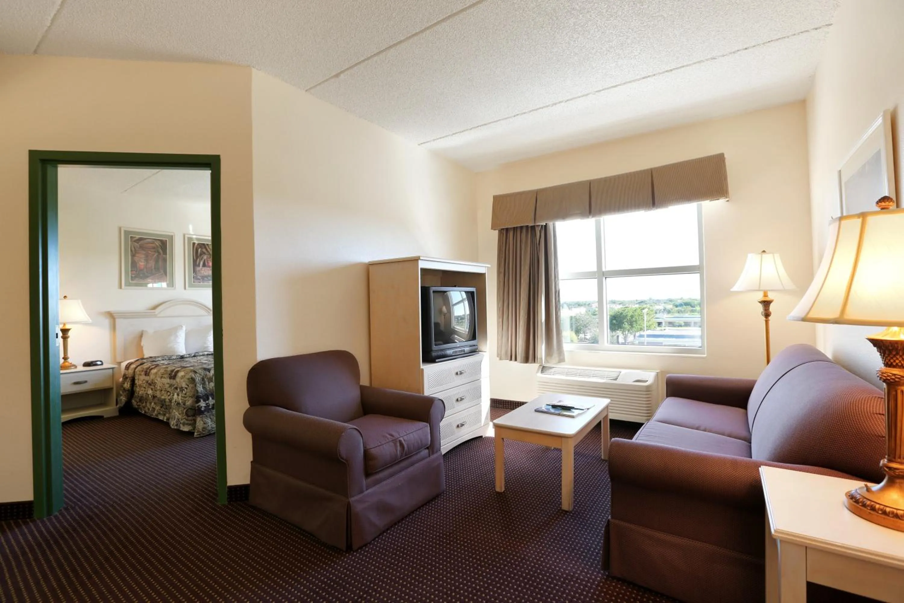 Living room, Bed in Allure Suites of Fort Myers