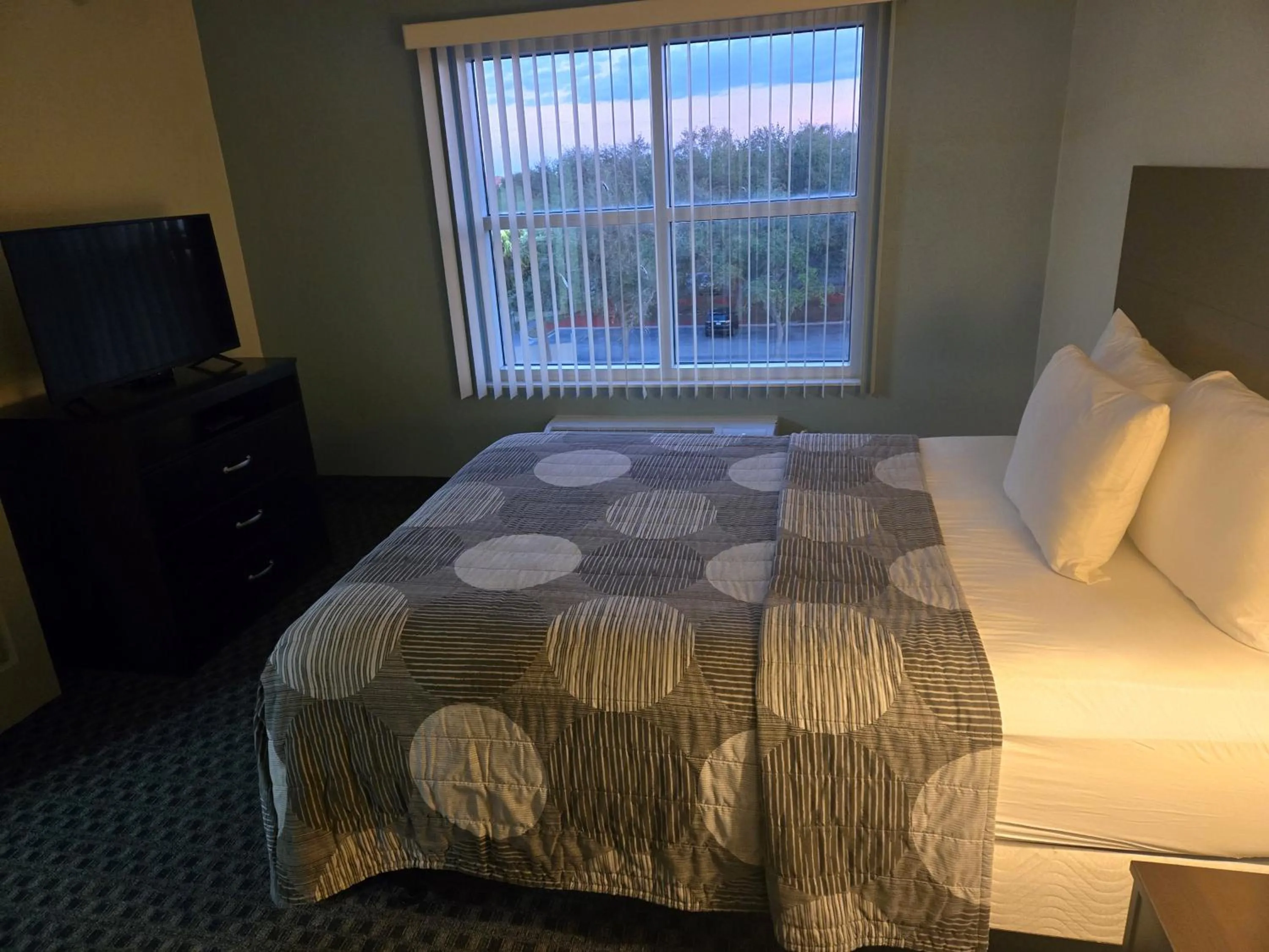 Bed in Allure Suites of Fort Myers