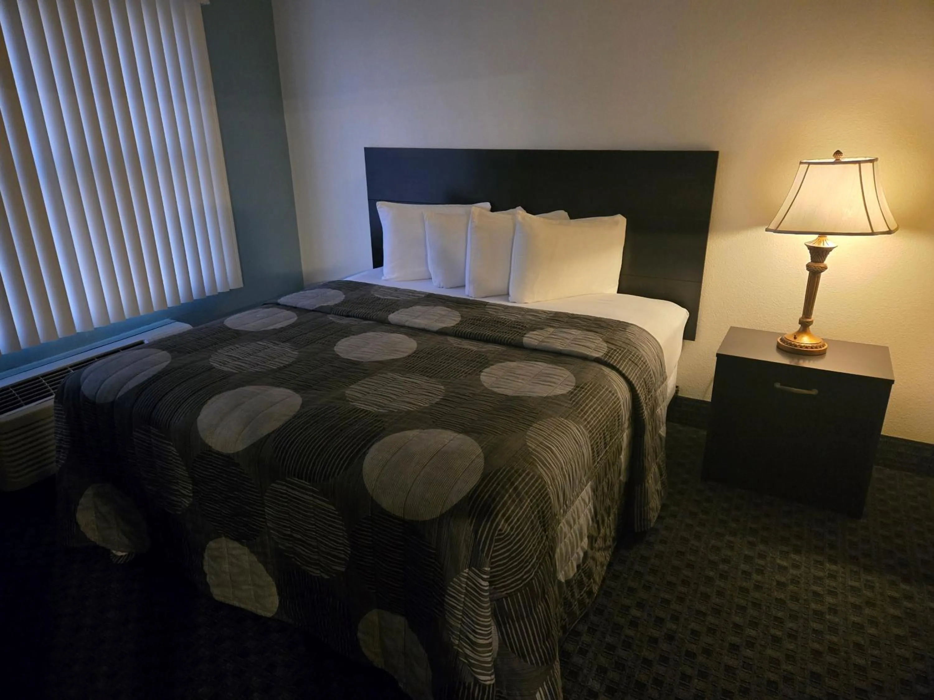 Bed in Allure Suites of Fort Myers