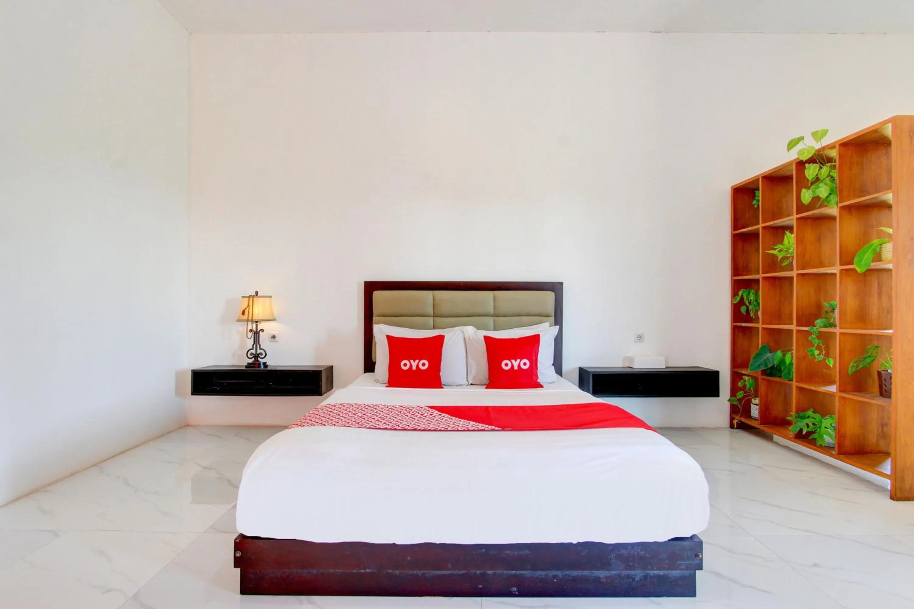 Bedroom in OYO 93885 D'harjo Guesthouse