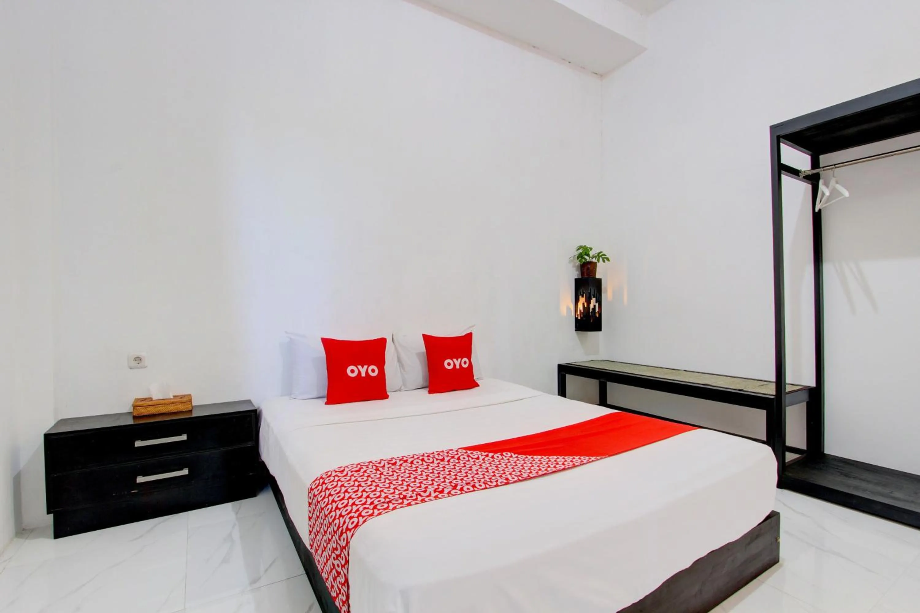 Bedroom in OYO 93885 D'harjo Guesthouse