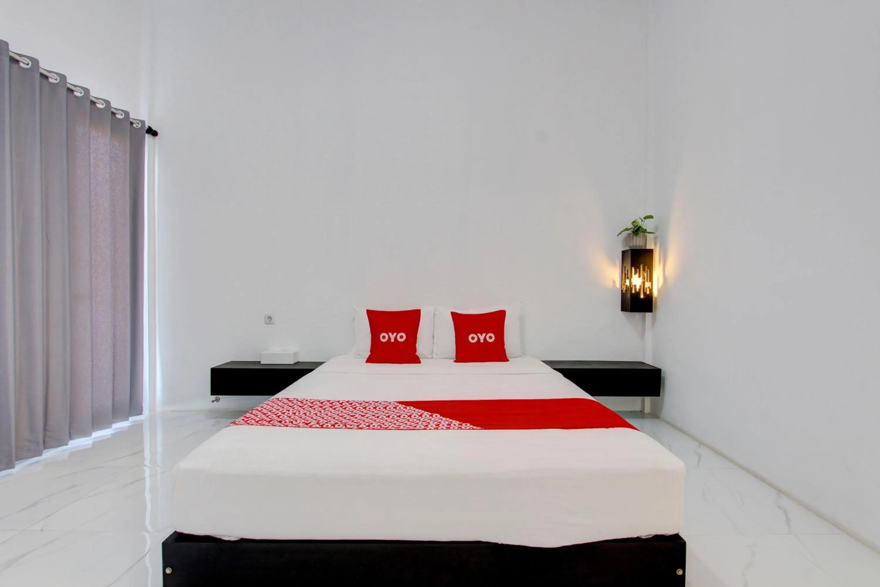 Bedroom in OYO 93885 D'harjo Guesthouse