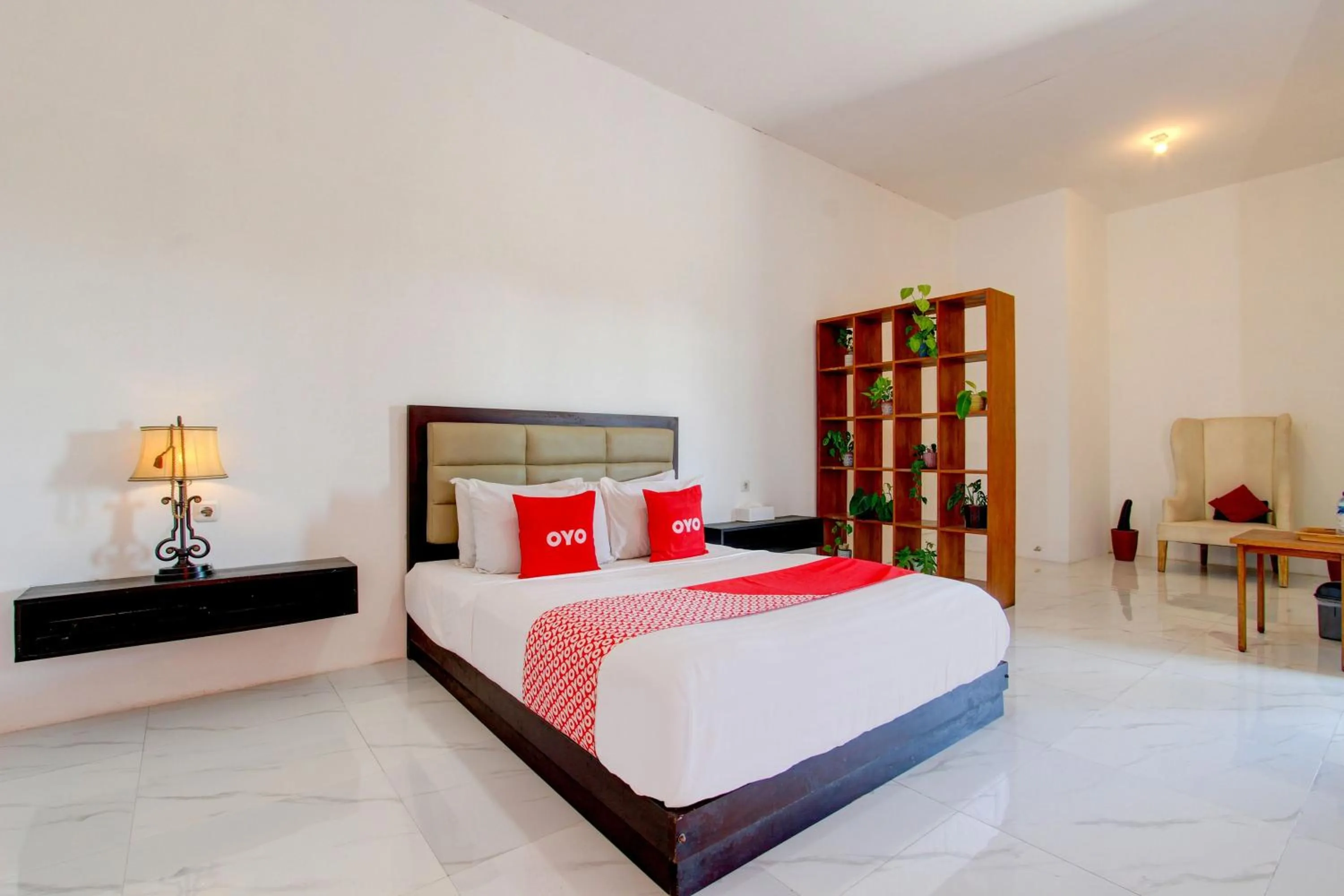 Bedroom in OYO 93885 D'harjo Guesthouse