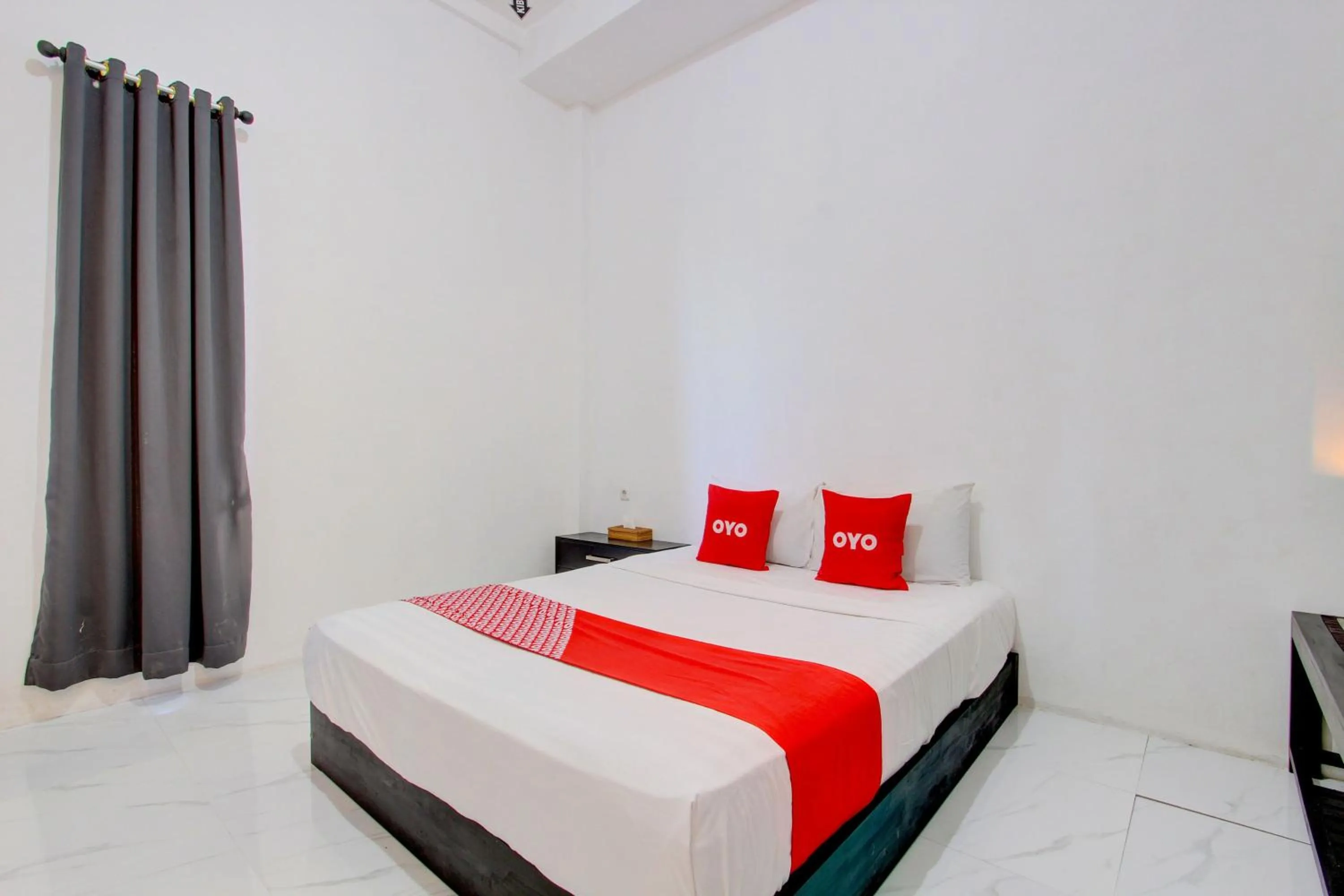 Bedroom in OYO 93885 D'harjo Guesthouse