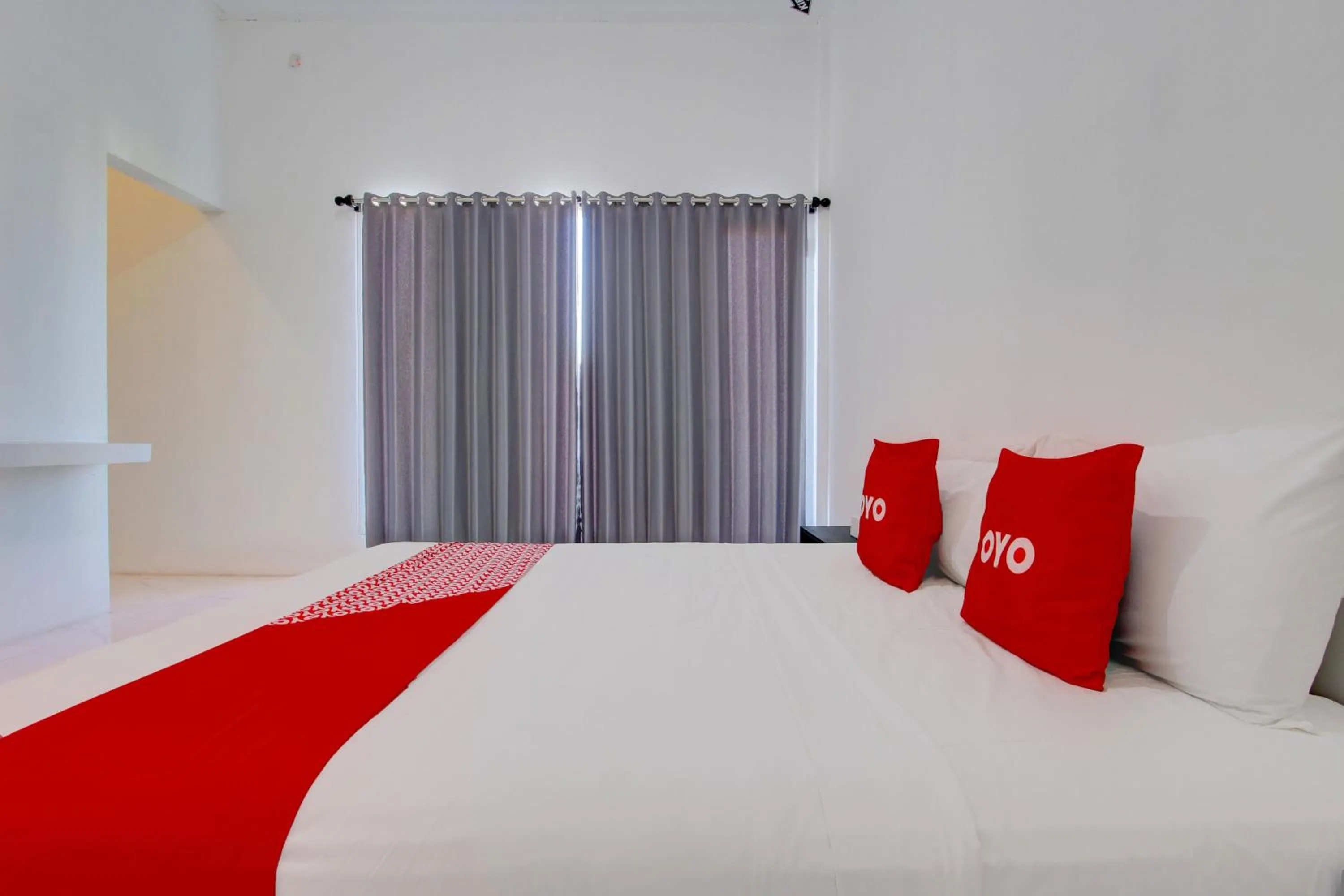 Bedroom in OYO 93885 D'harjo Guesthouse