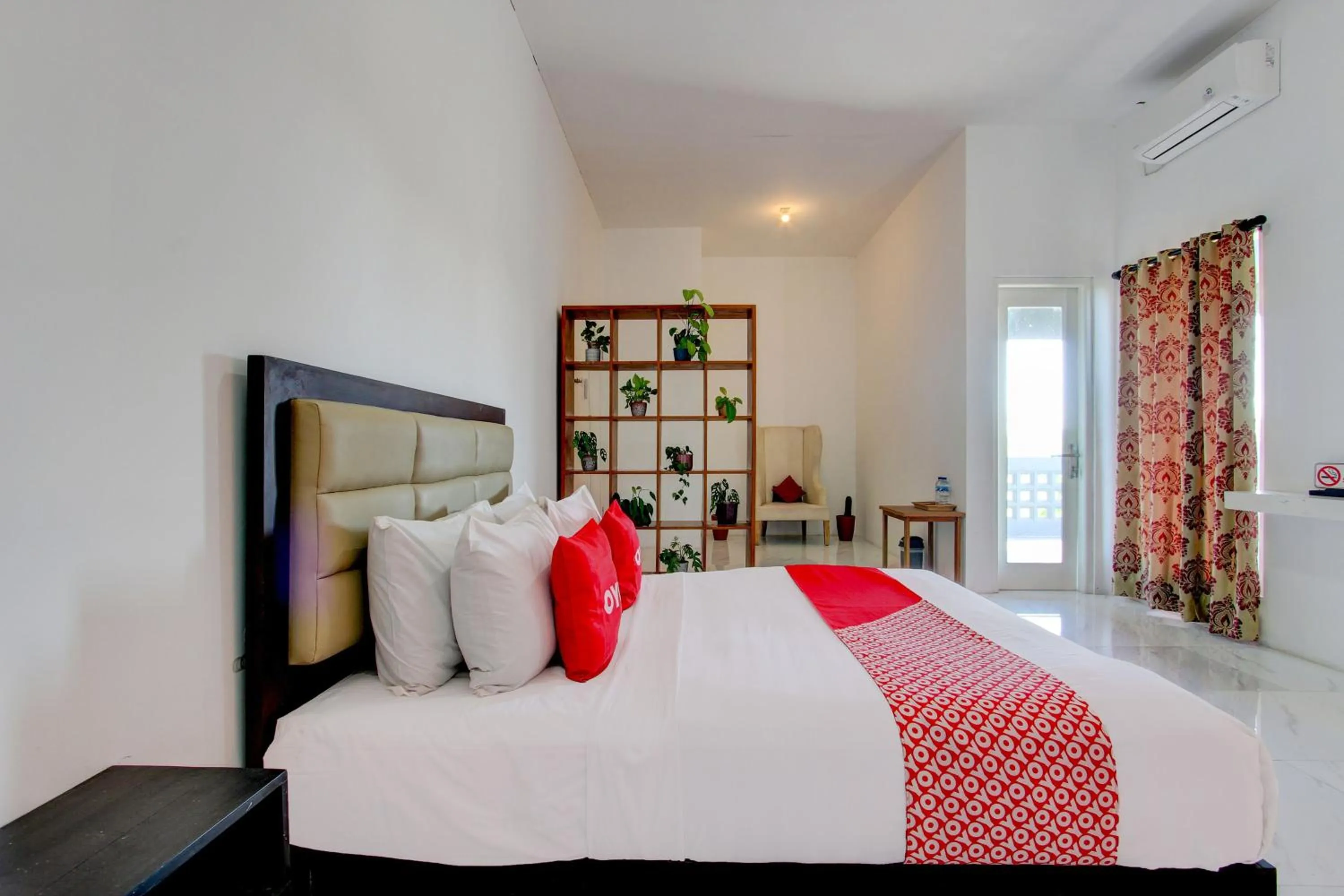 Bedroom in OYO 93885 D'harjo Guesthouse