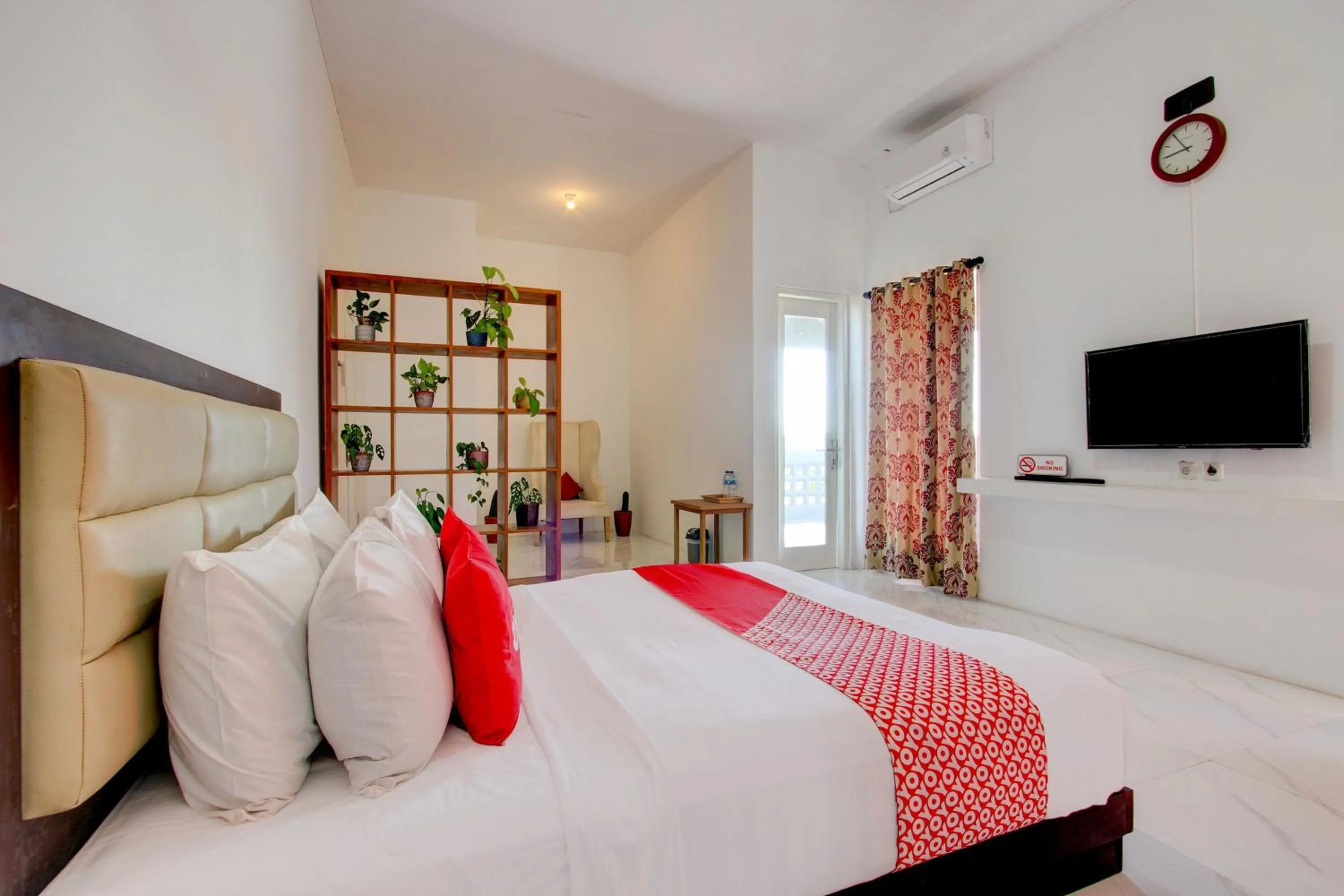 Bedroom in OYO 93885 D'harjo Guesthouse