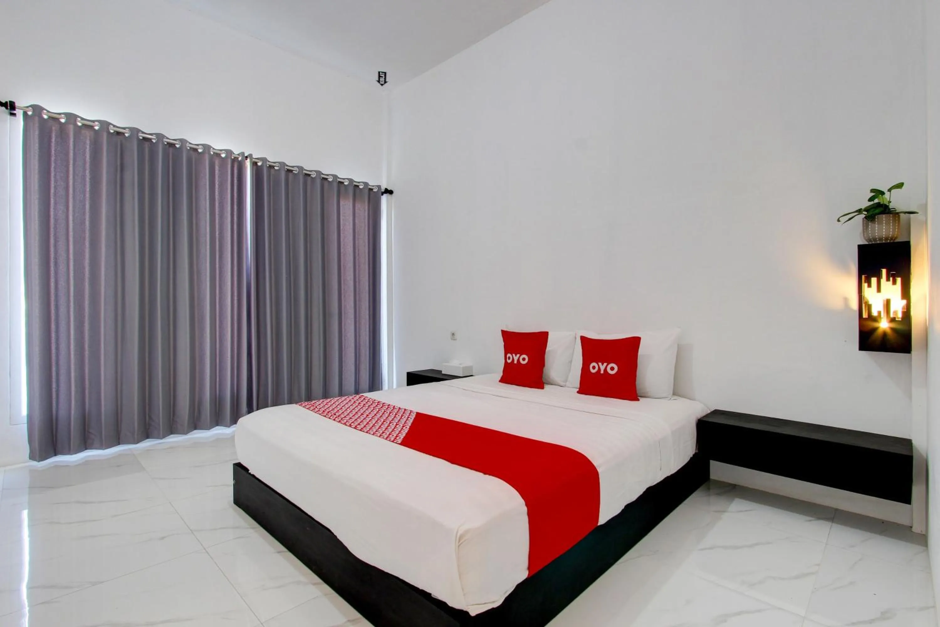 Bedroom in OYO 93885 D'harjo Guesthouse