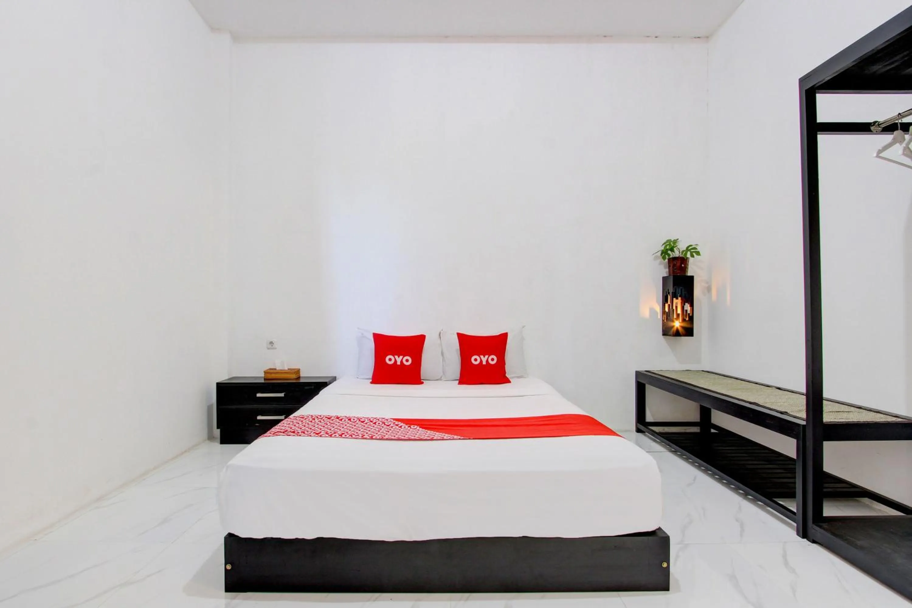 Bedroom in OYO 93885 D'harjo Guesthouse