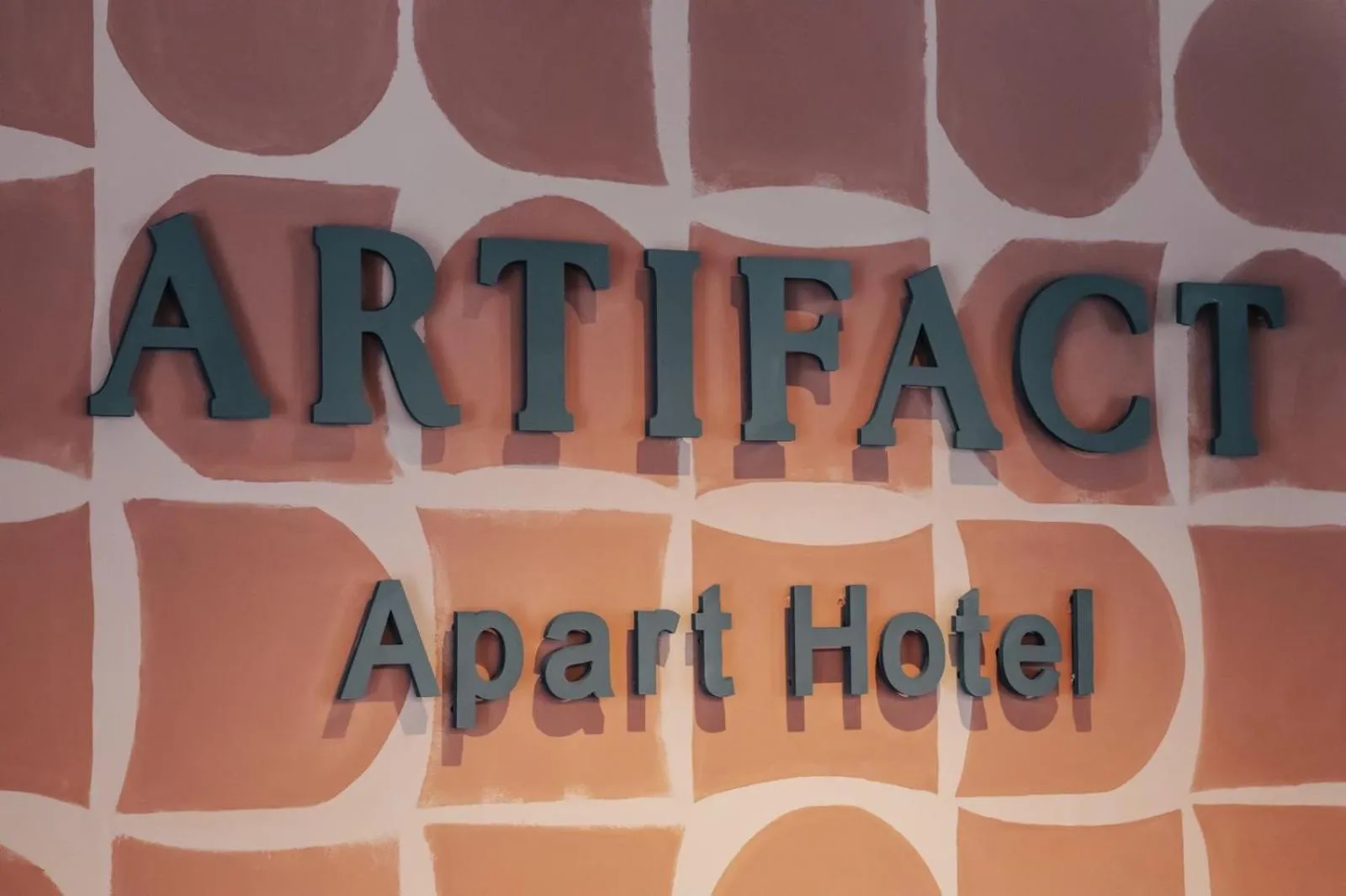 Property logo or sign in Artifact Apart Hotel
