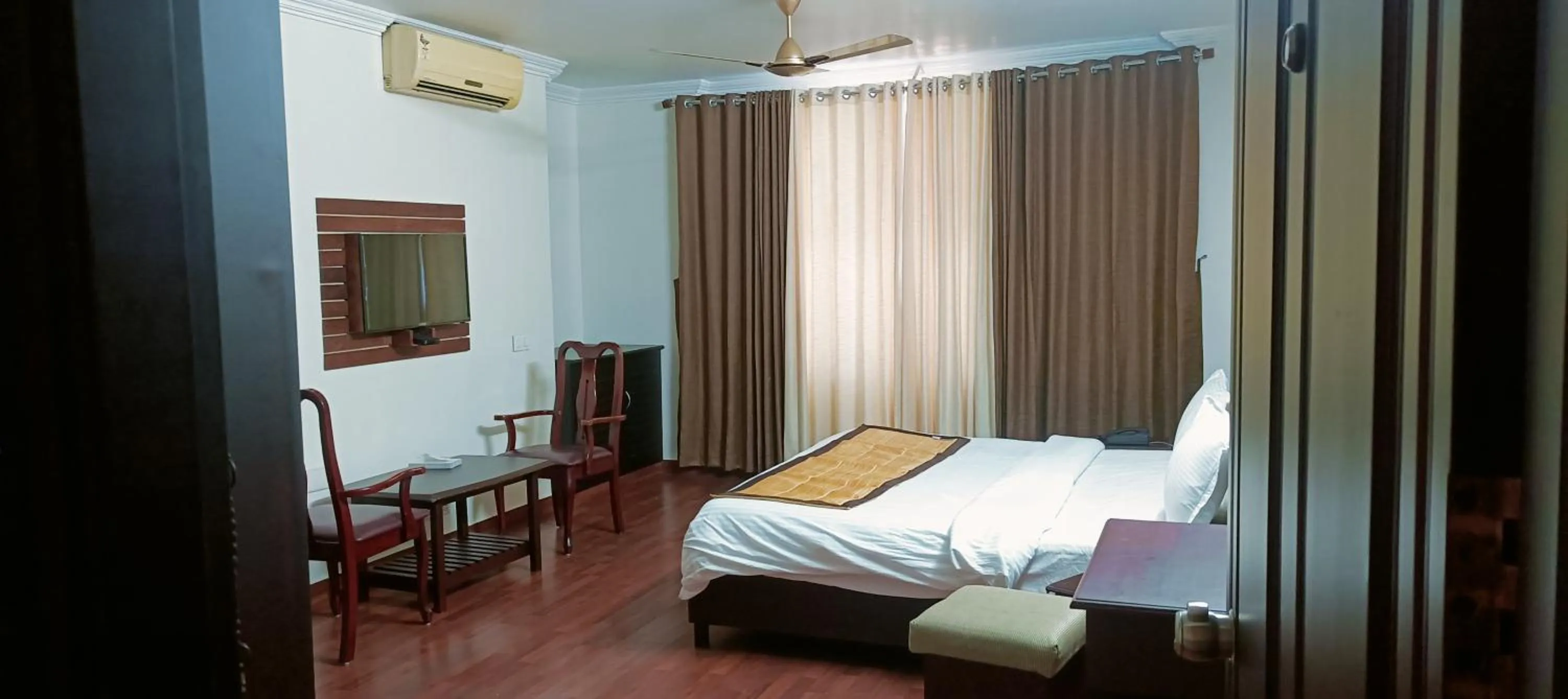 Bed in Malanadu Tourist Home