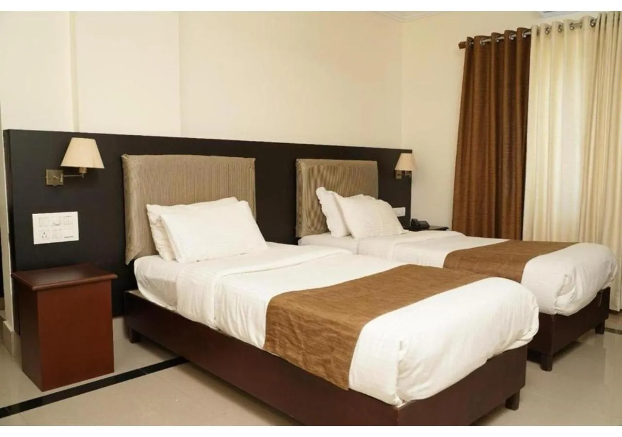 Bed in Malanadu Tourist Home