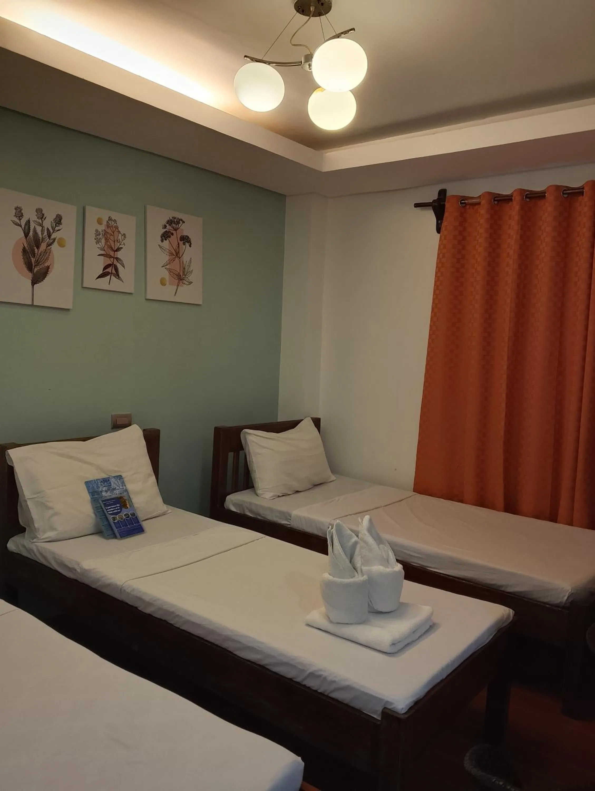 Bed in Aqua Travel Lodge