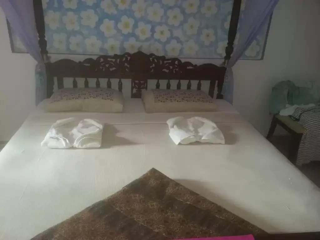 Bed in Solomon Beach Hotel