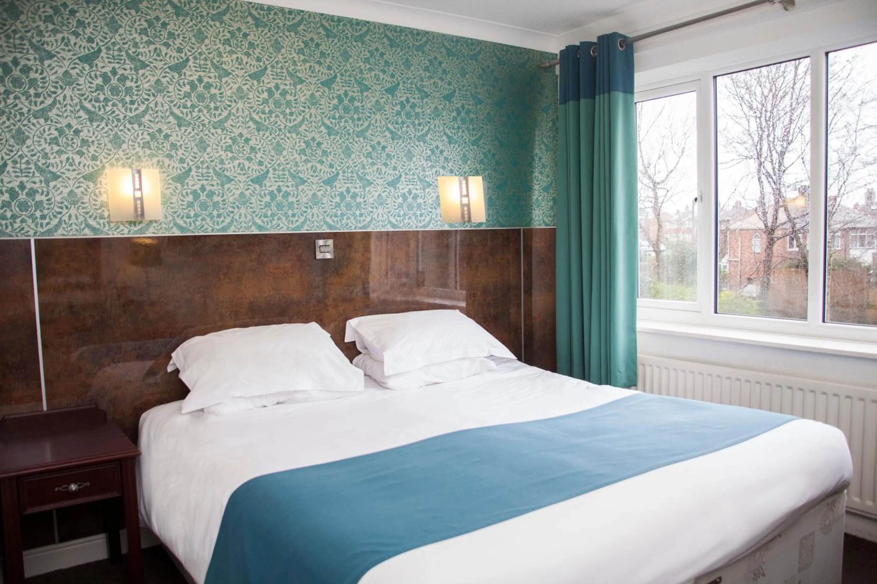 Bedroom in The Victoria Hotel Manchester by Compass Hospitality
