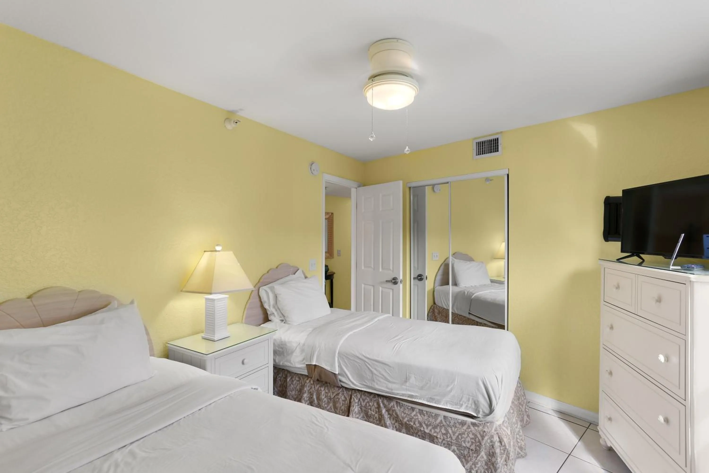 Bed in South Beach Condo Hotel by Travel Resort Services, Inc.