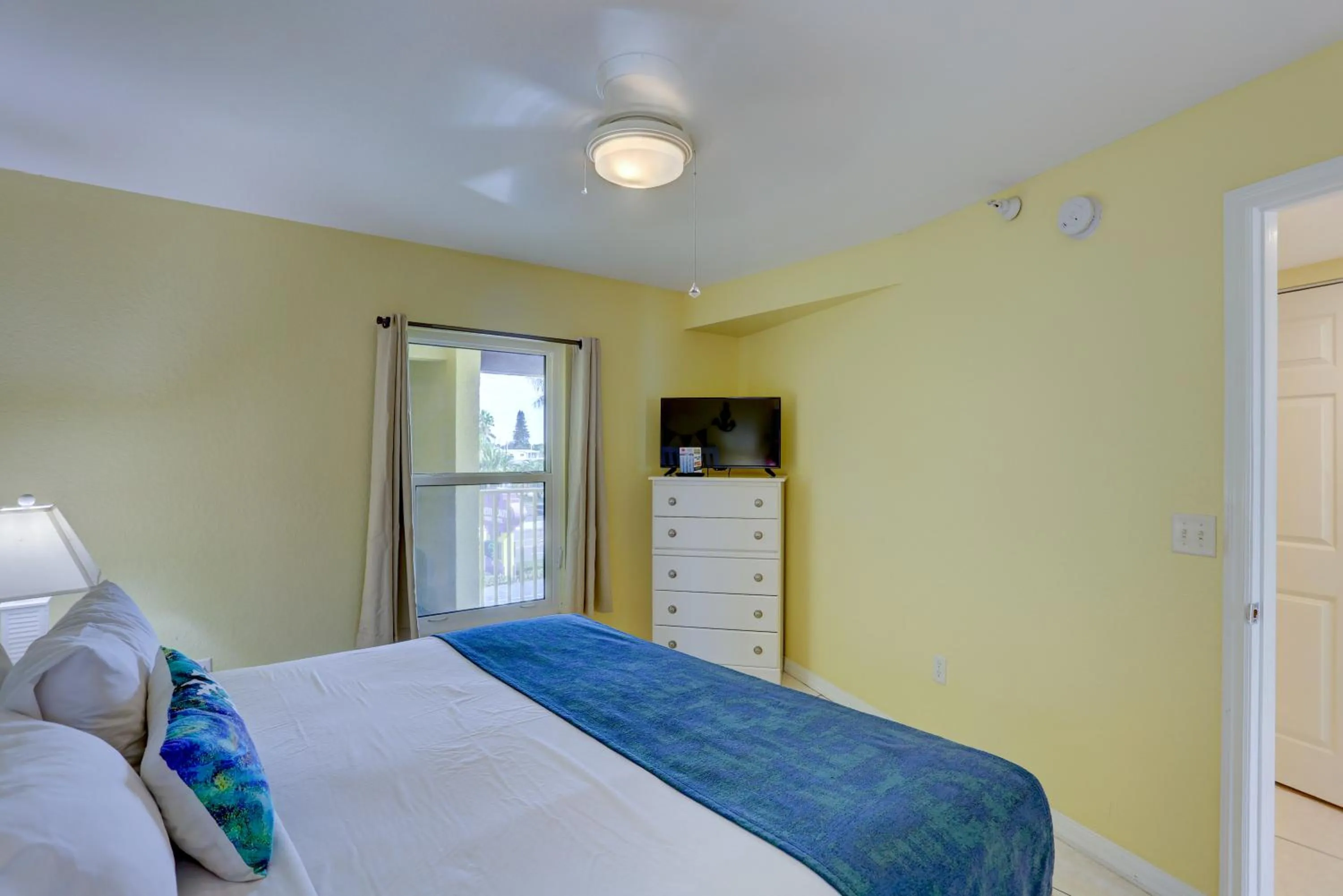 Bed in South Beach Condo Hotel by Travel Resort Services, Inc.