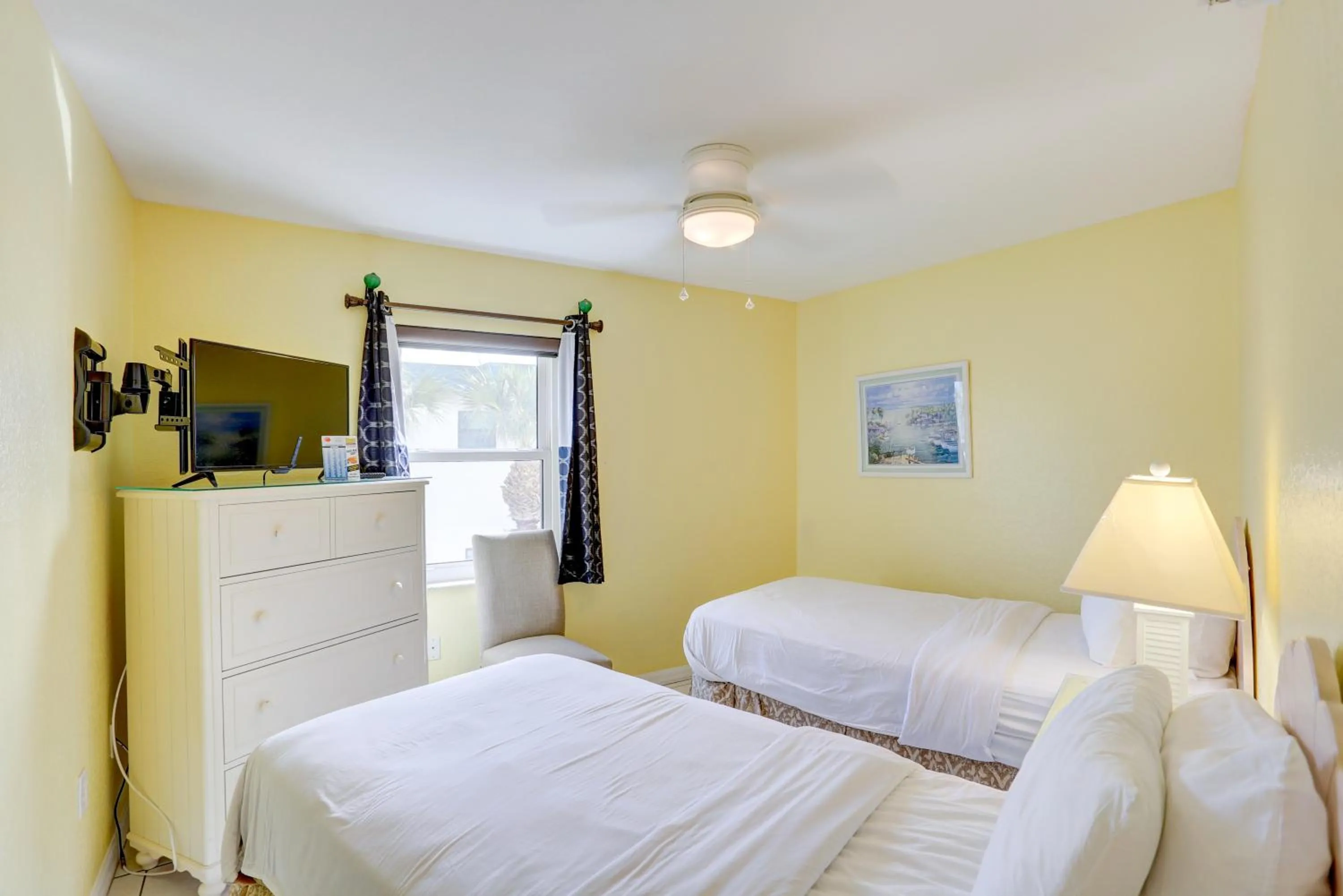 Bed in South Beach Condo Hotel by Travel Resort Services, Inc.