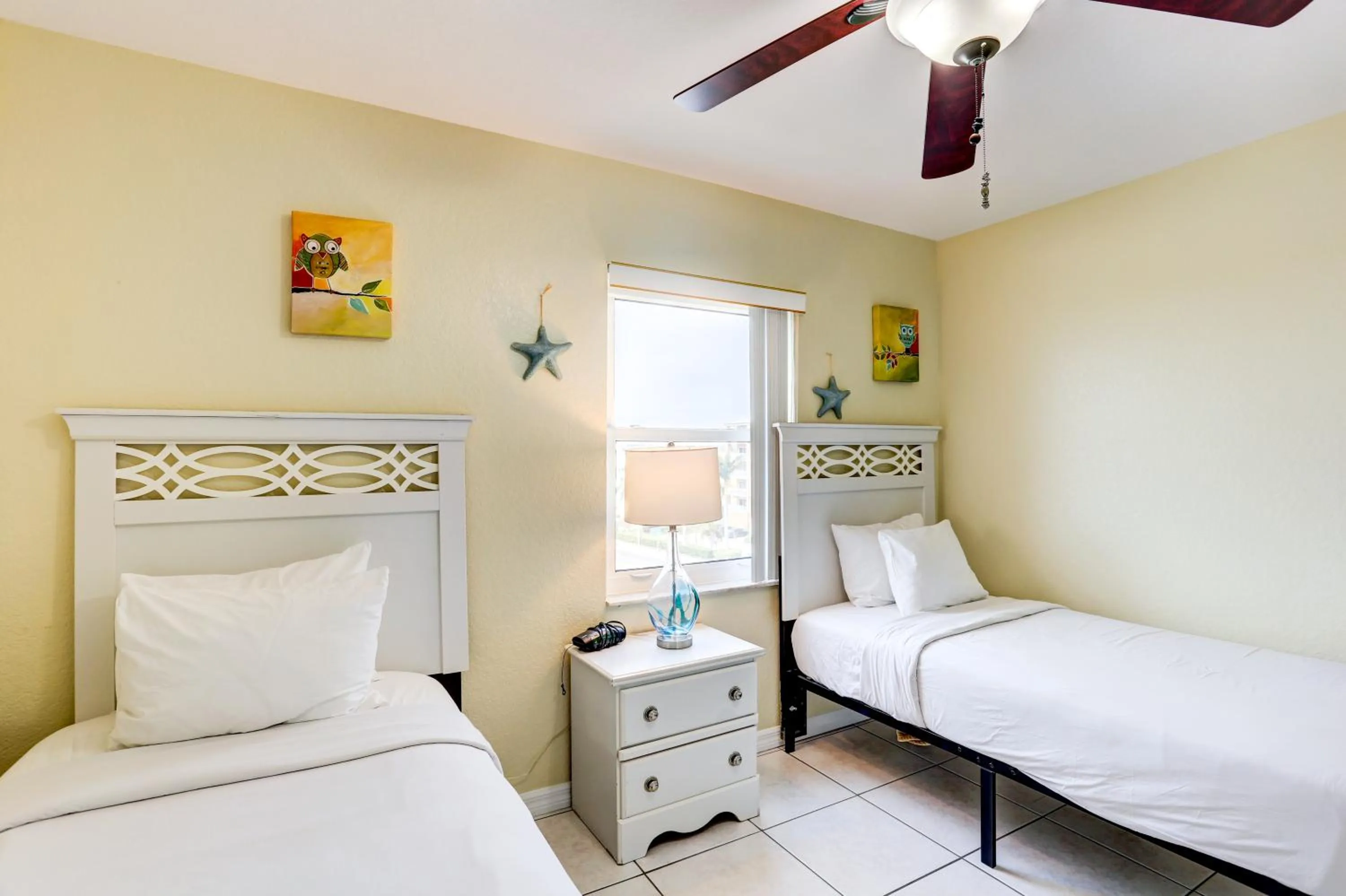 Bed in South Beach Condo Hotel by Travel Resort Services, Inc.