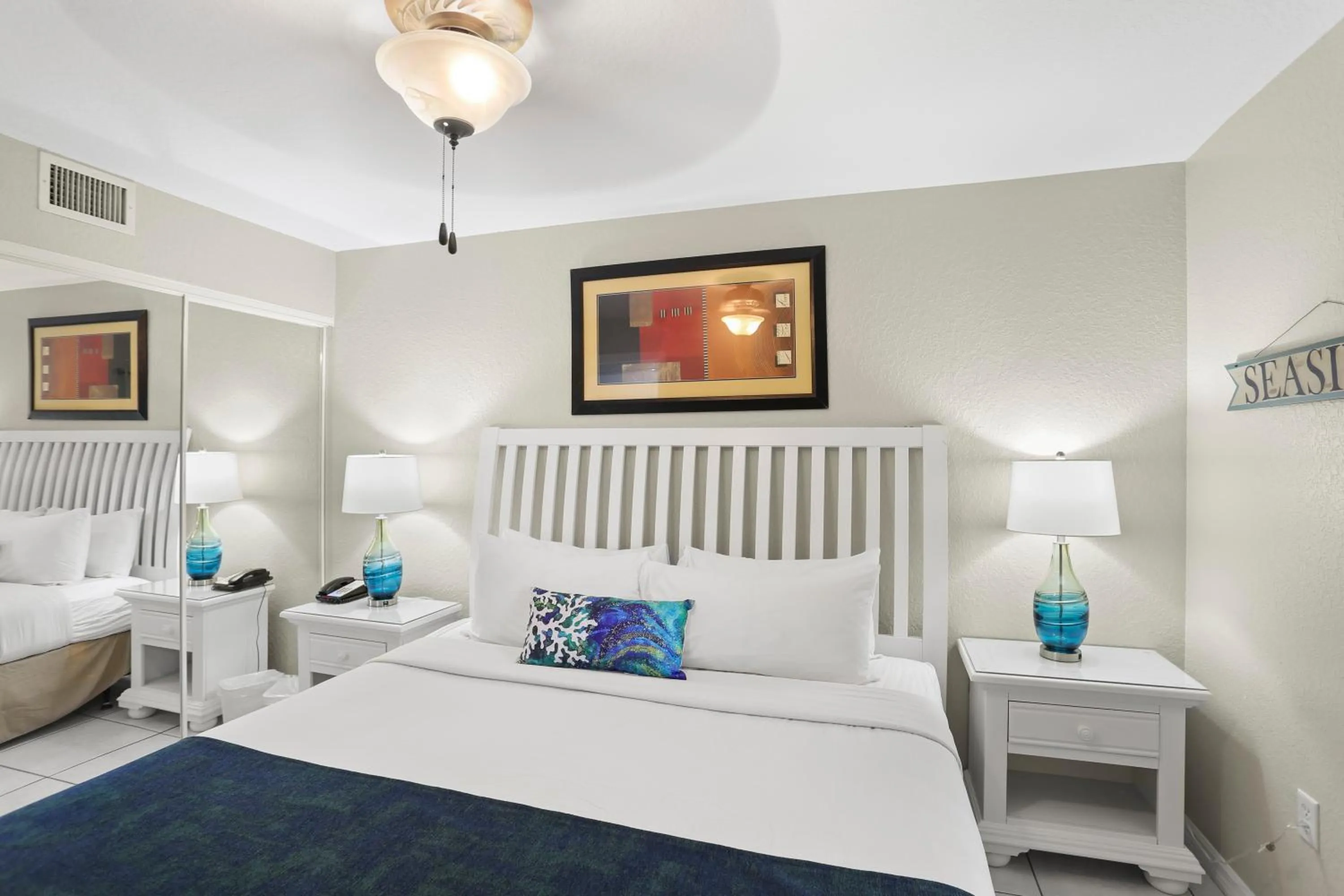 Bed in South Beach Condo Hotel by Travel Resort Services, Inc.