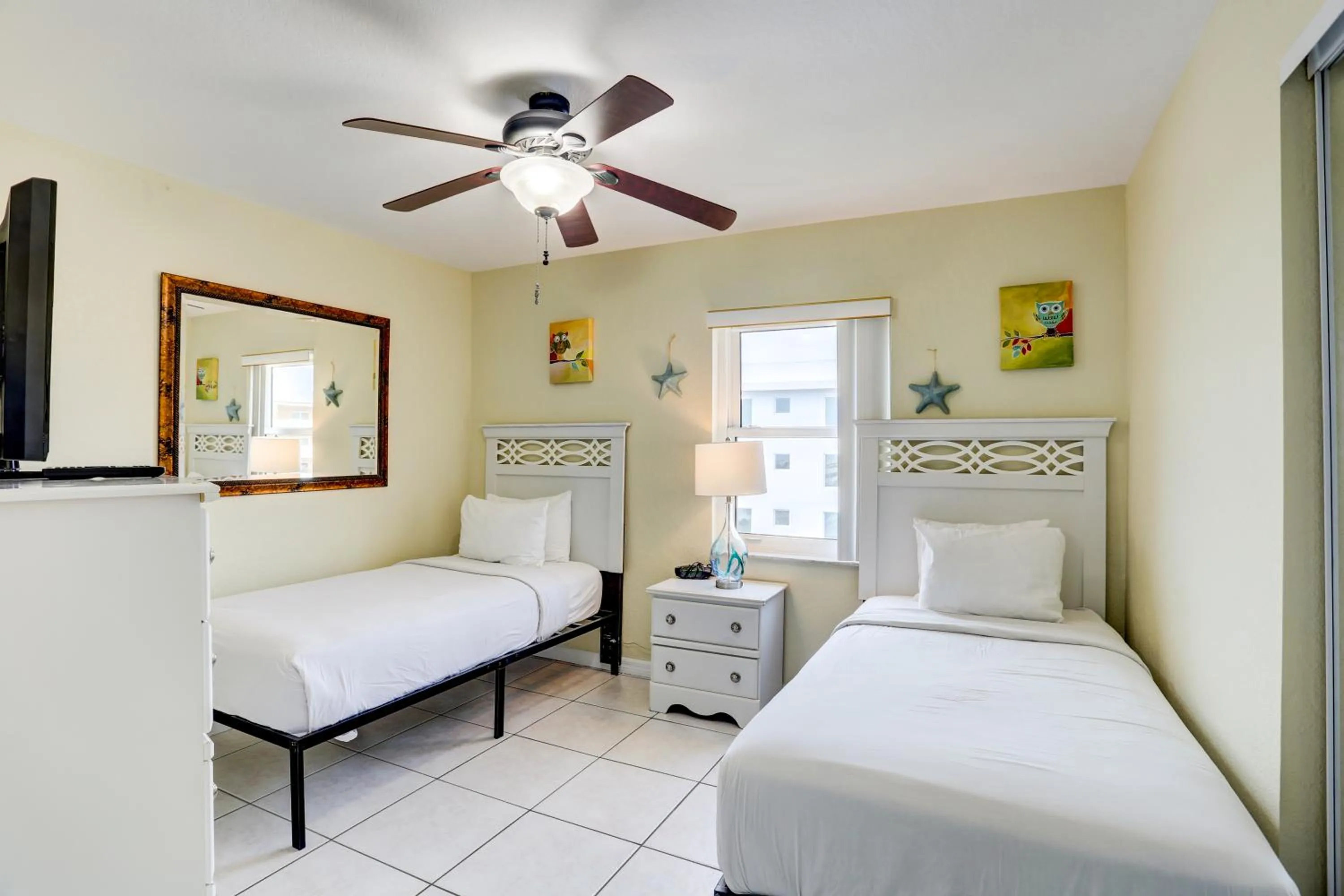 Bed in South Beach Condo Hotel by Travel Resort Services, Inc.