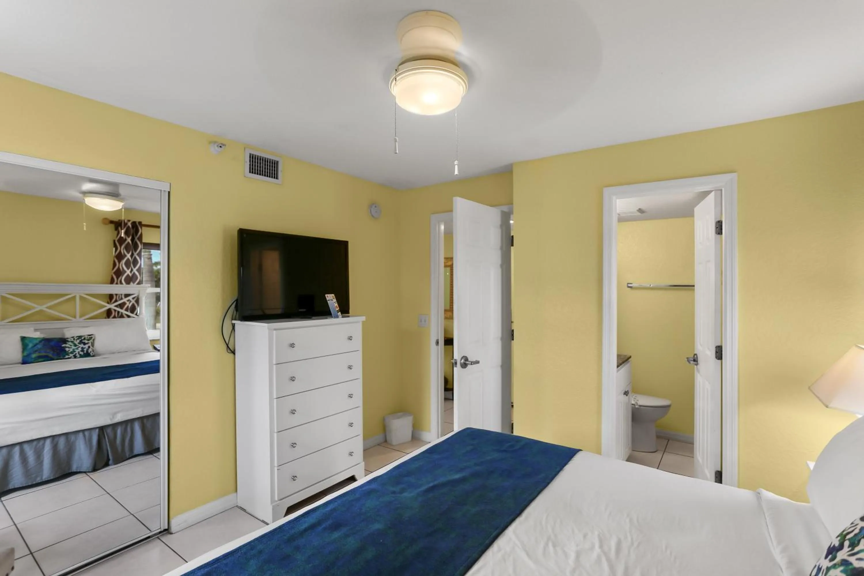 Bed in South Beach Condo Hotel by Travel Resort Services, Inc.