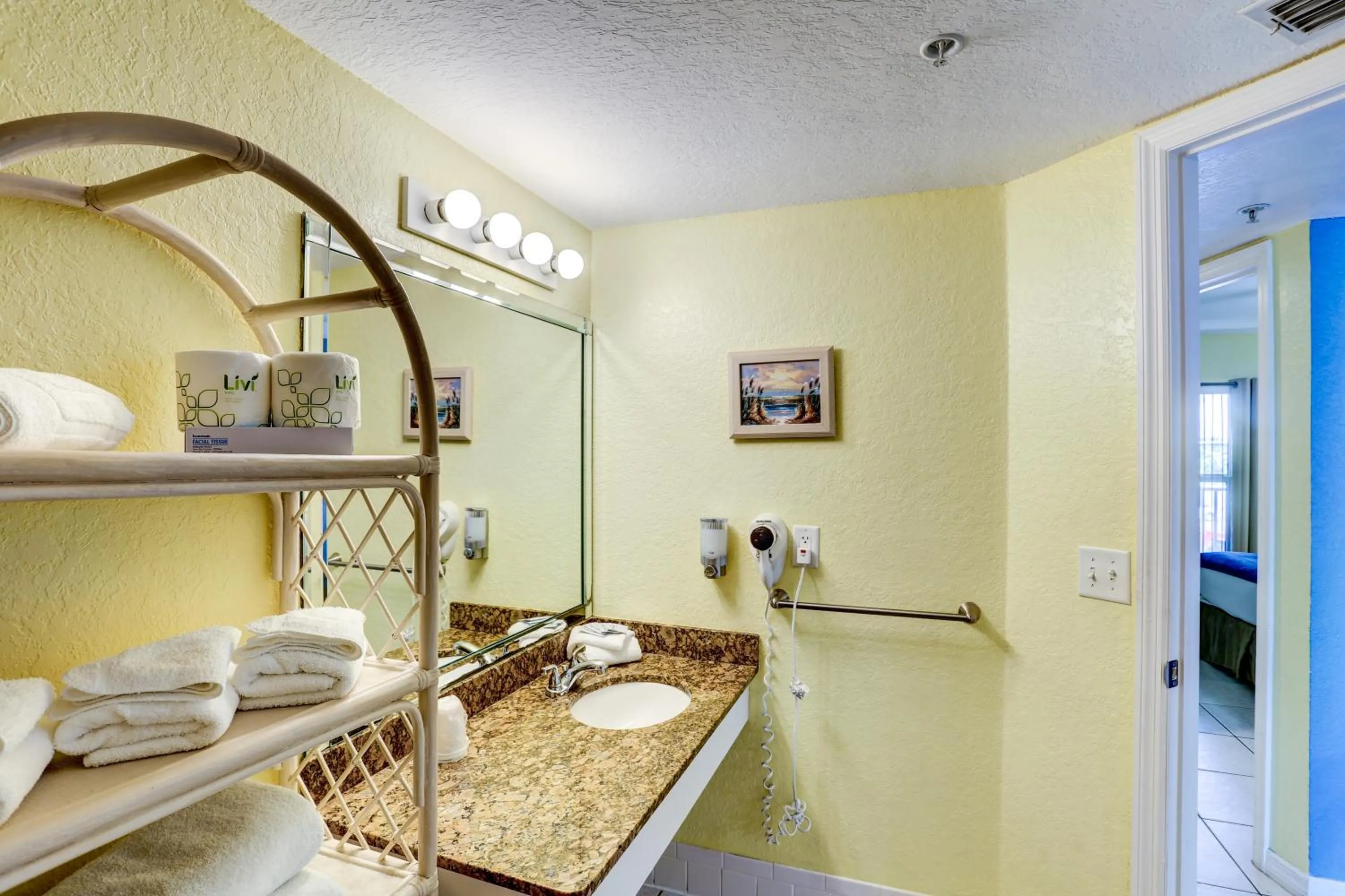 Bed in South Beach Condo Hotel by Travel Resort Services, Inc.