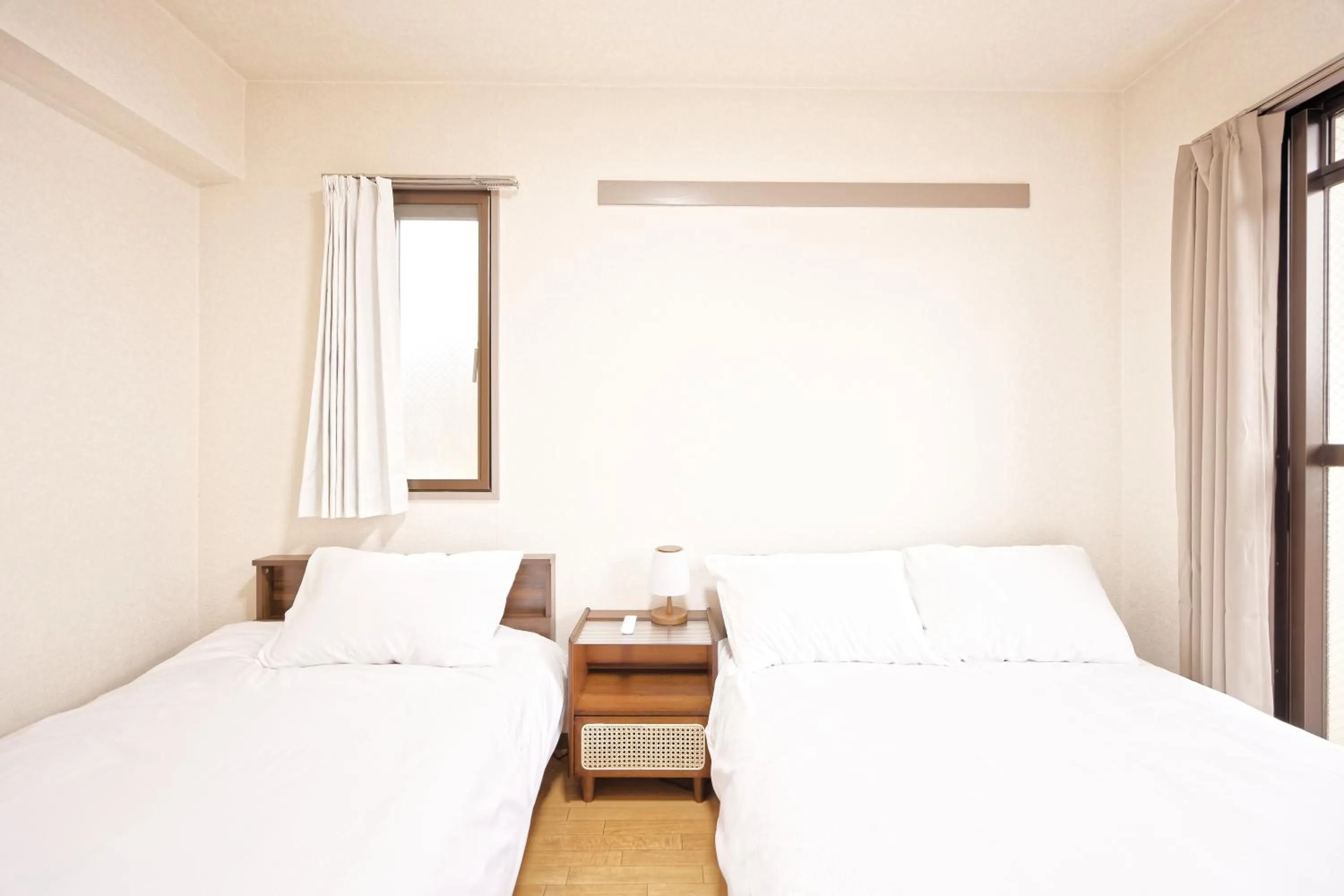 Bed in Shinjuku Waseda Earthtone Apartment